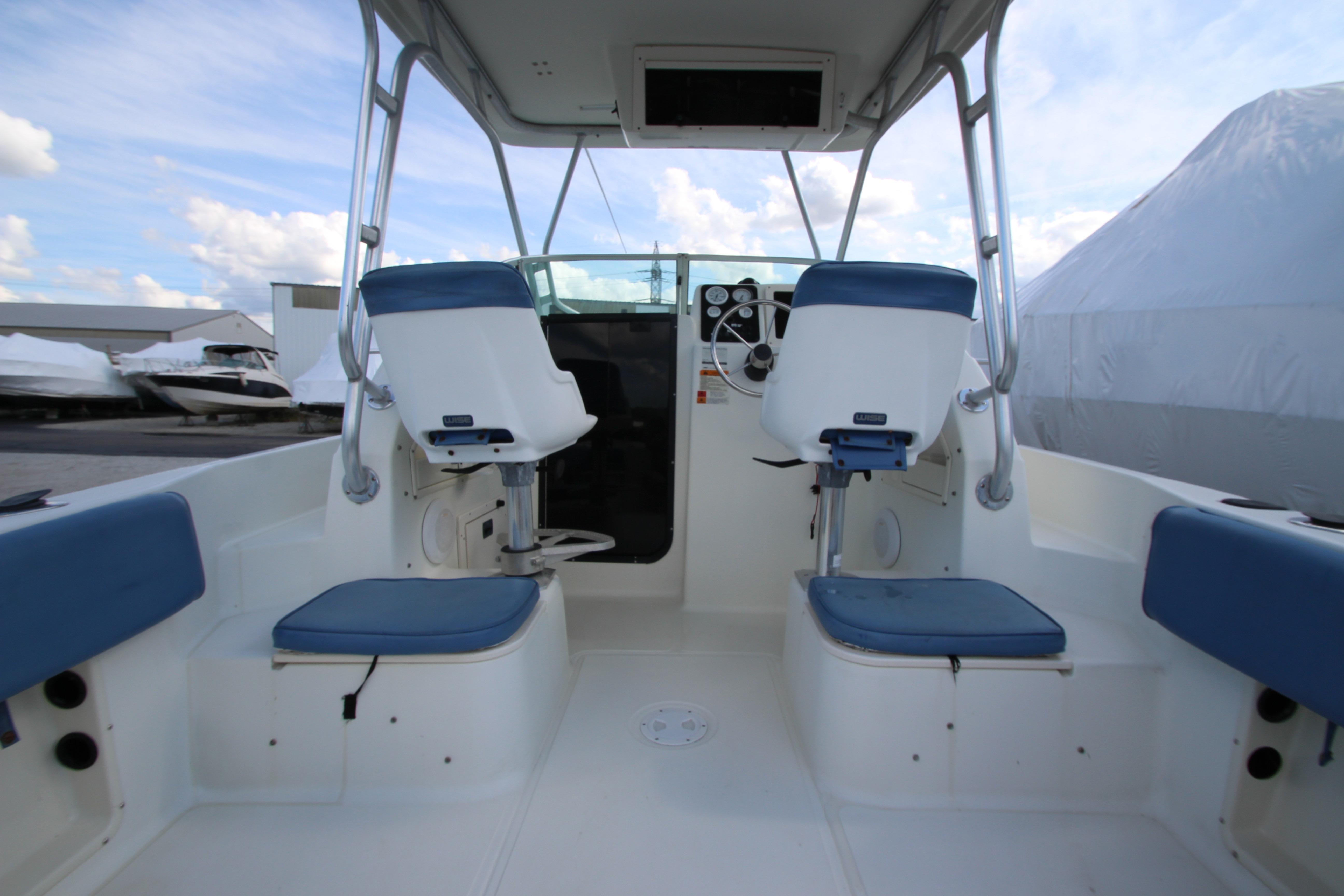 2002 Hydra-Sports 230 WA boat interior with blue seating and steering console.
