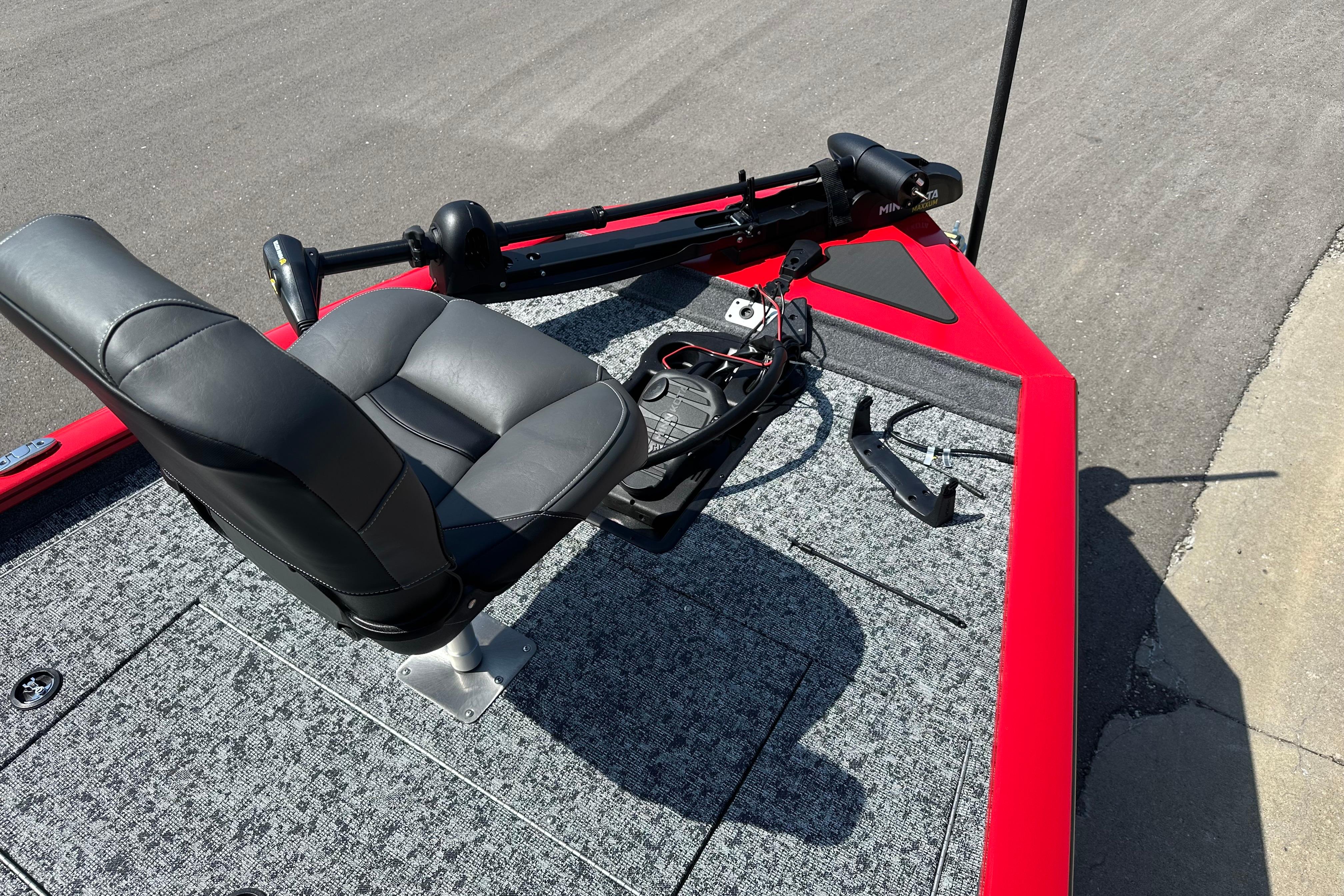 2026 Tracker Pro Team 195 boat deck with seat and trolling motor.