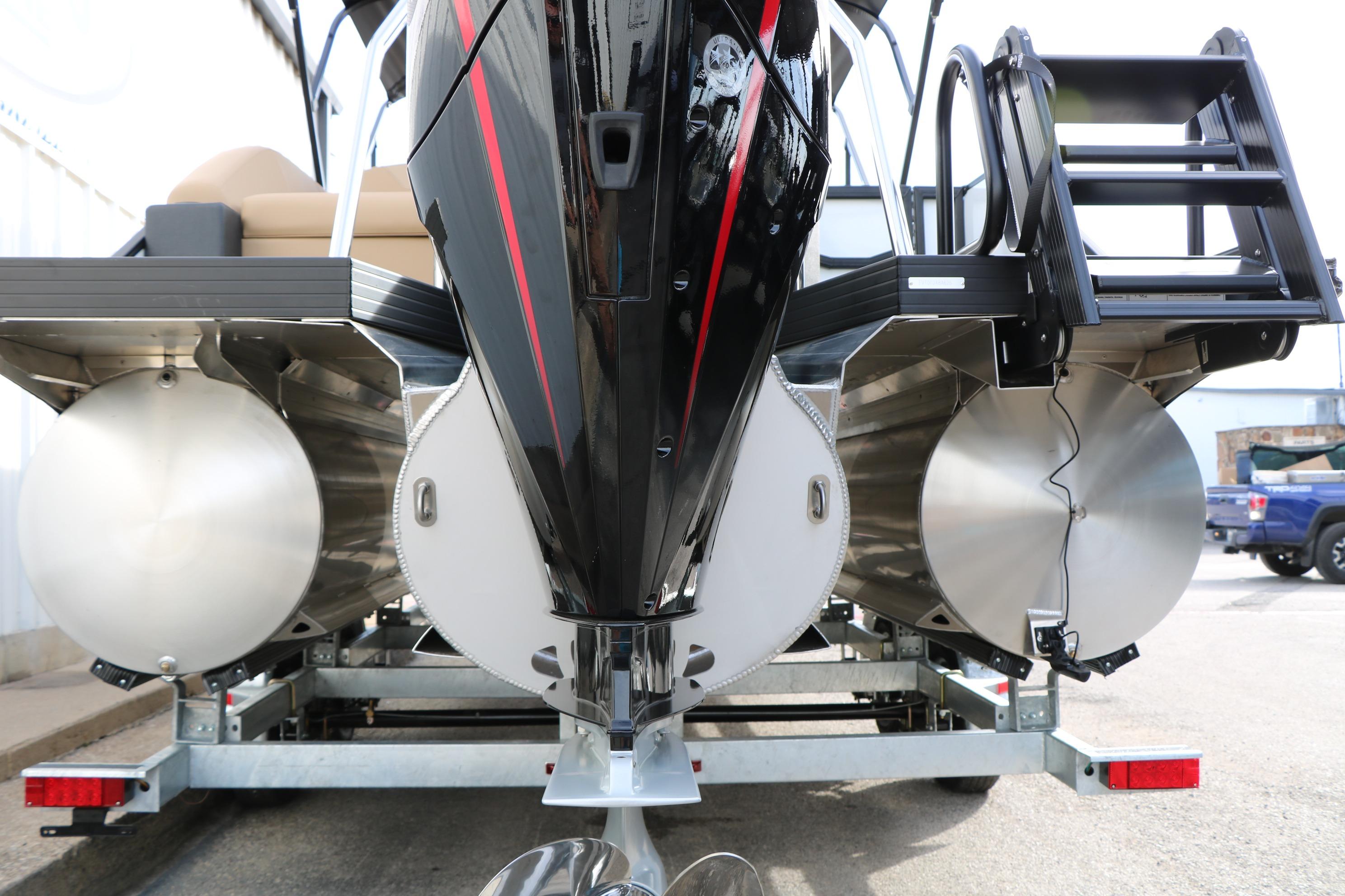 Rear view of 2026 Evotti 523CS pontoon boat on trailer, showcasing dual pontoons.