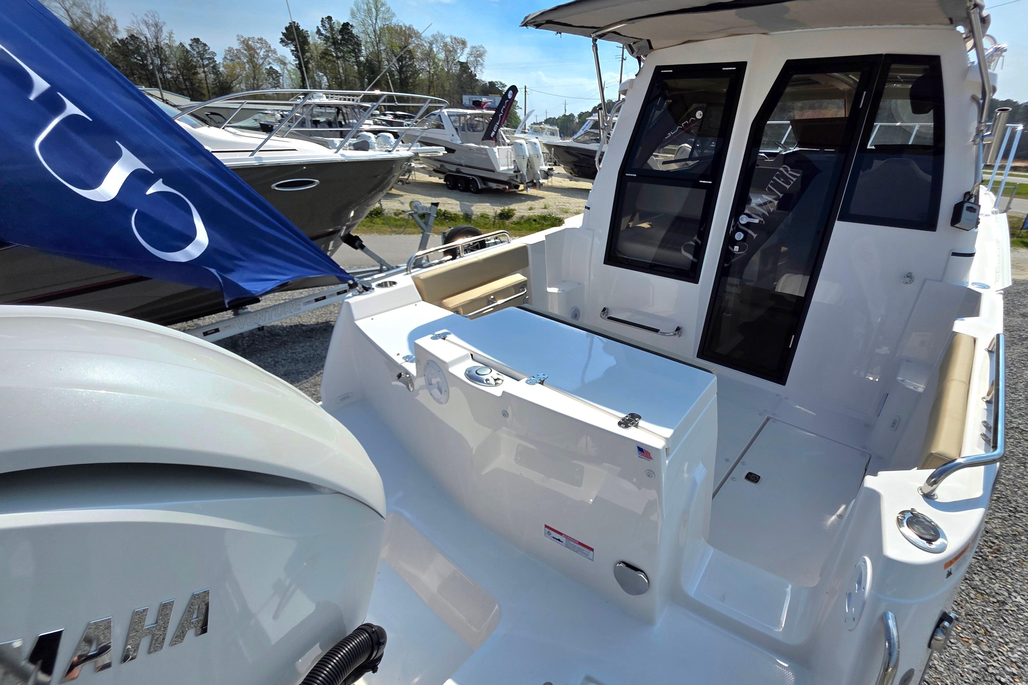 2026 Cutwater C-248 Coupe boat with Yamaha engine, docked outdoors.