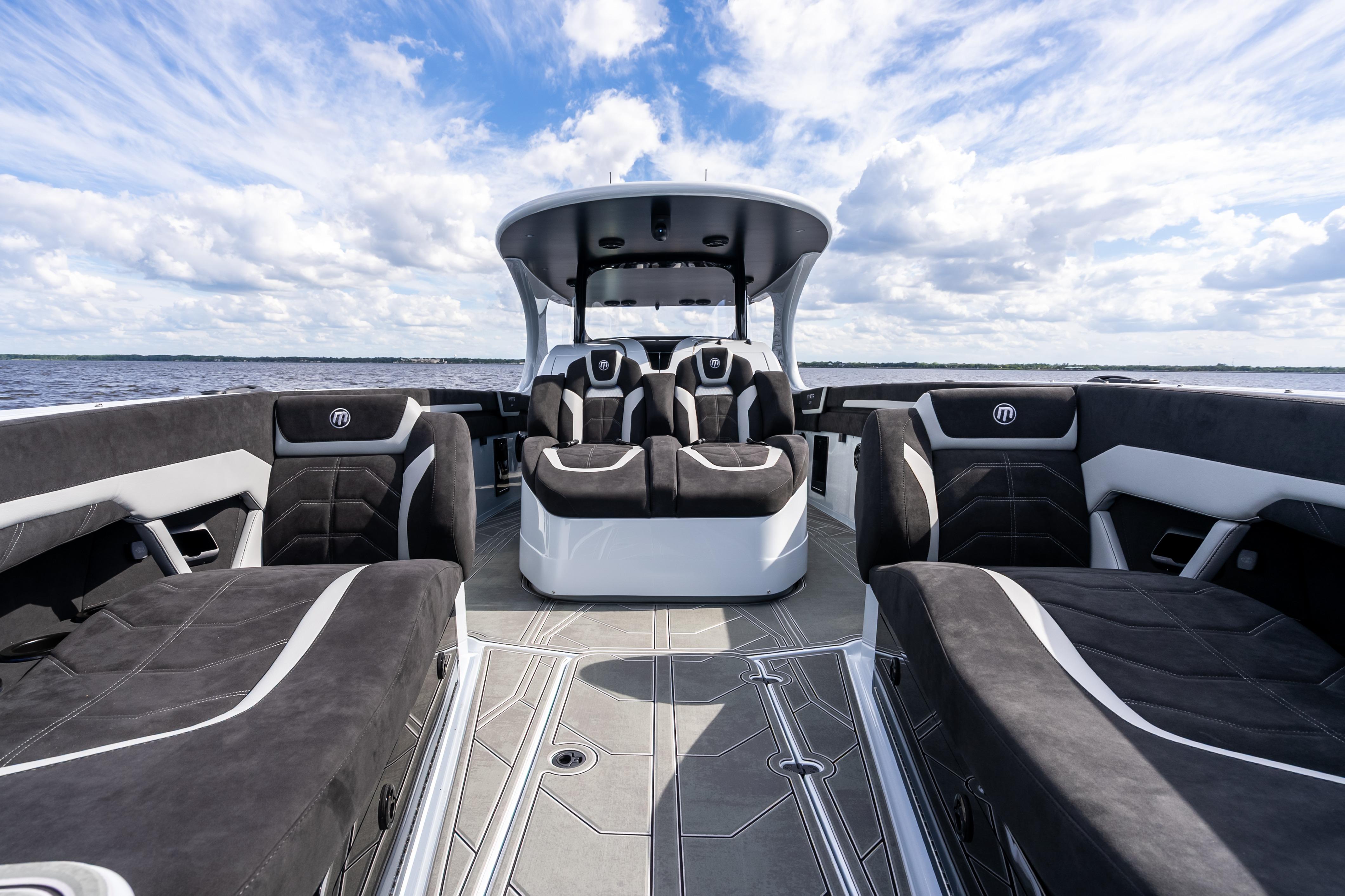 Luxurious 2027 Mystic Powerboats M4200 interior with sleek seating and modern design on open water.