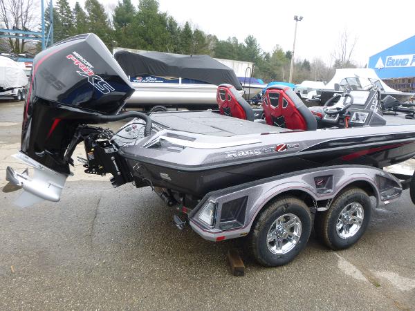 2025 Ranger Z519R Cup-Equipped boat with powerful outboard motor, parked outdoors.