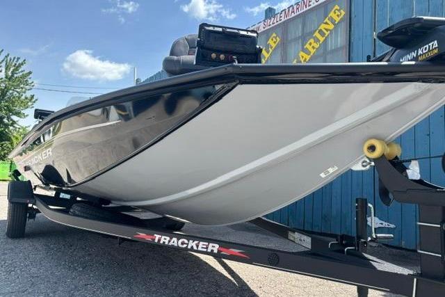 2023 Tracker Pro Team 190 TX Tournament Edition boat on trailer, side view.