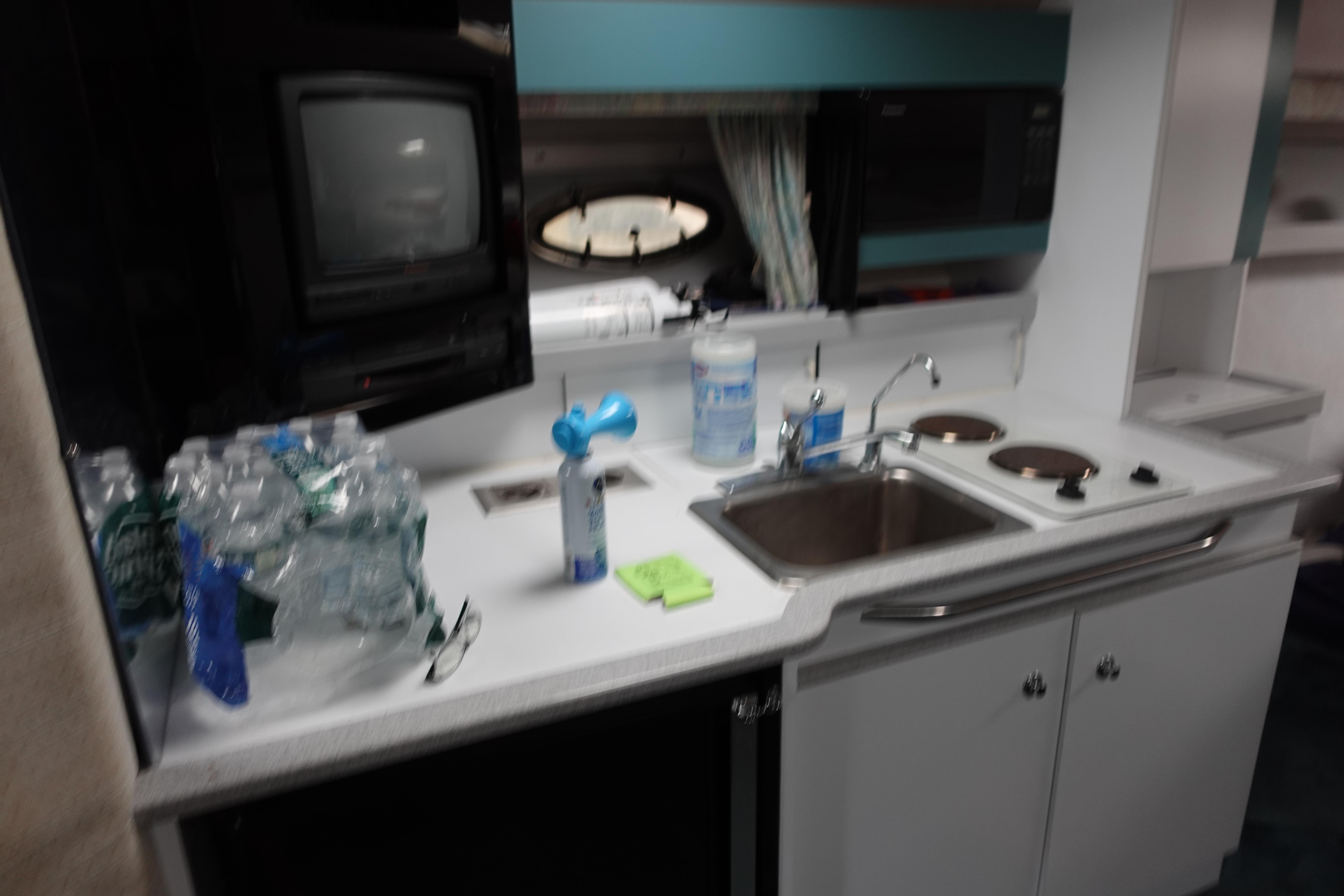 Interior of 1993 Formula 34 Performance Cruiser with kitchenette and appliances.