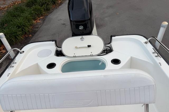 2016 Boston Whaler 150 Montauk boat interior with seating and storage compartments.