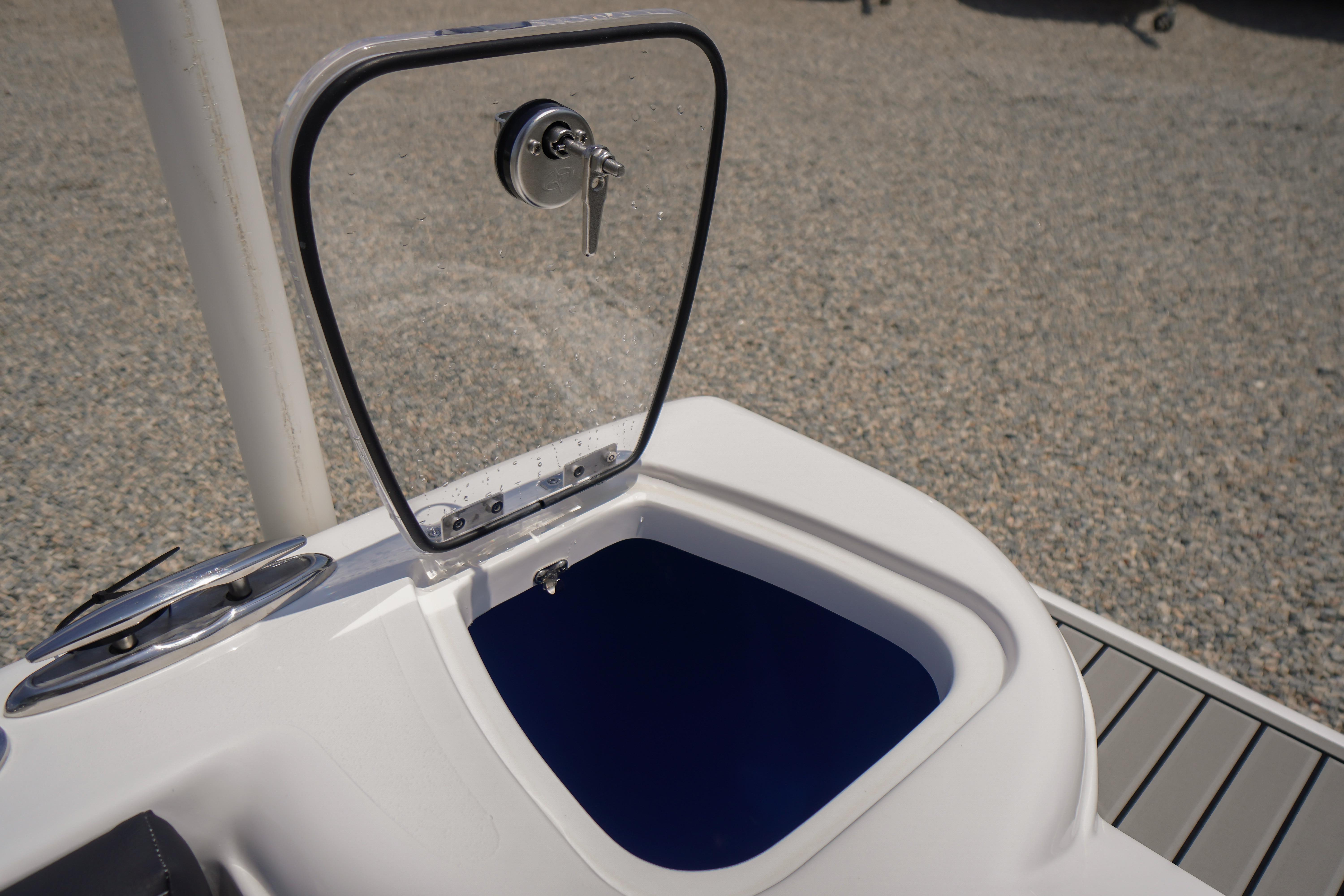 Open storage compartment on 2027 Tidewater 220 CC Adventure boat.