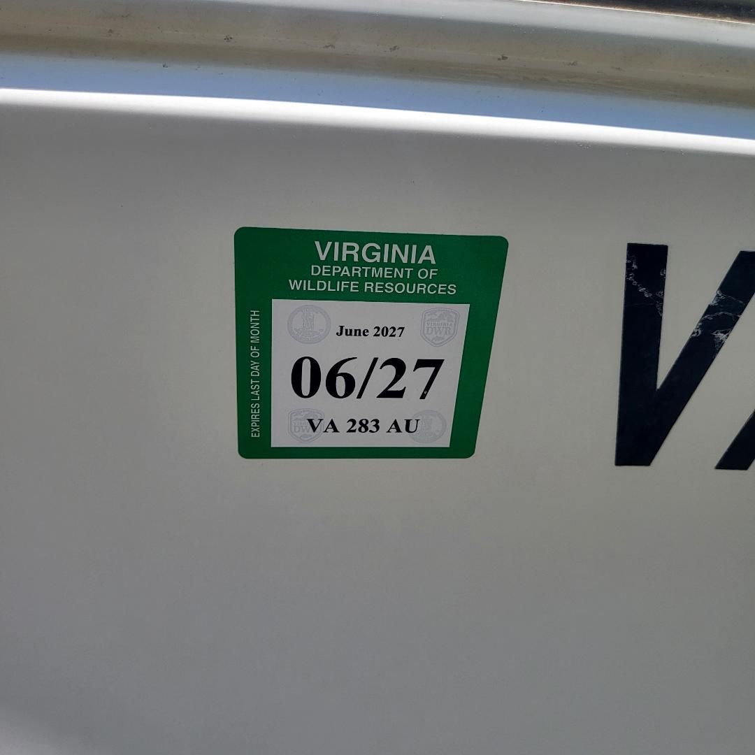 A boat with a green Virginia Wildlife Resources sticker, valid until June 2027.