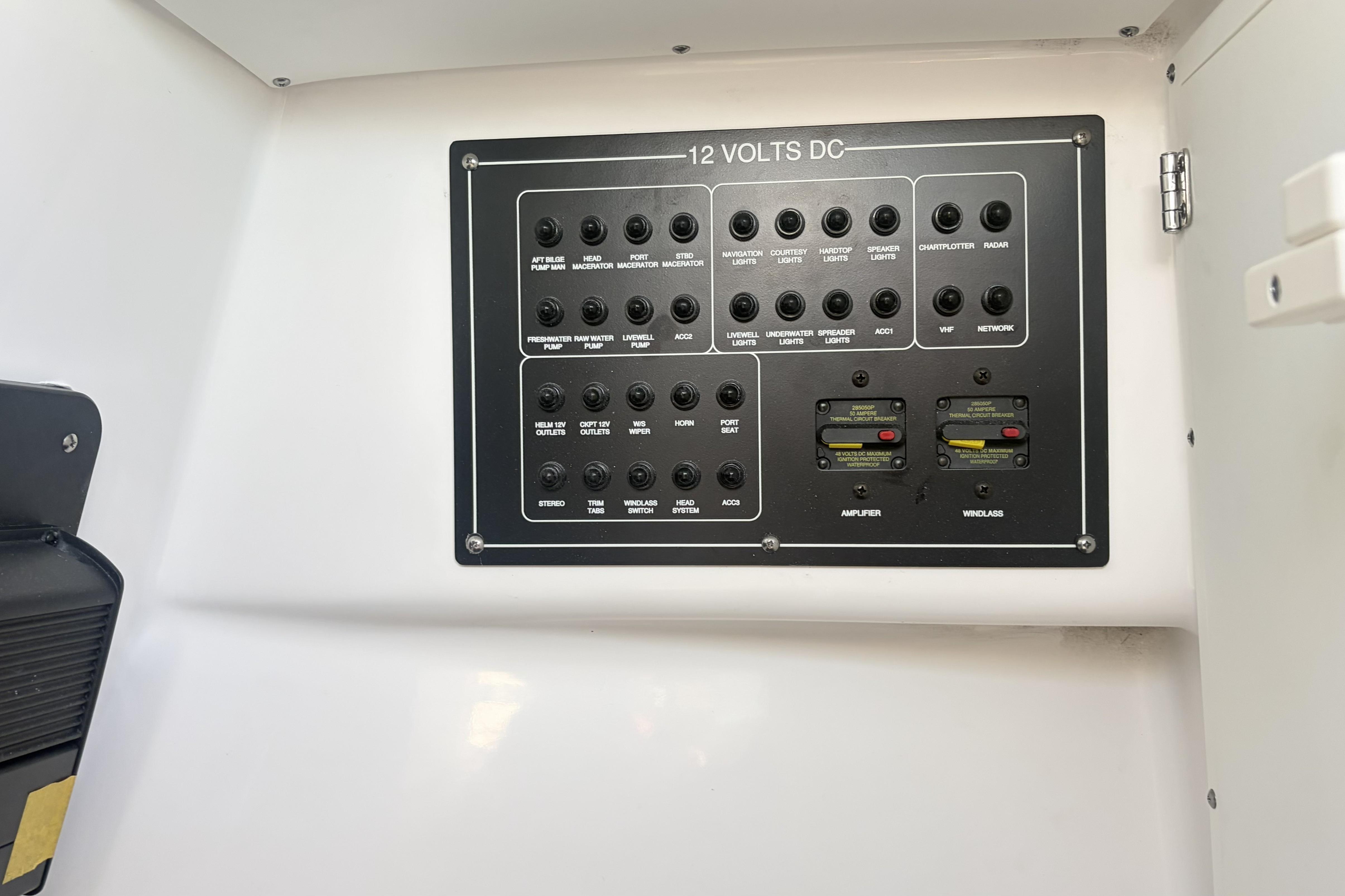 Electrical control panel on 2025 Blackfin 272 DC boat, featuring various switches and circuit breakers.