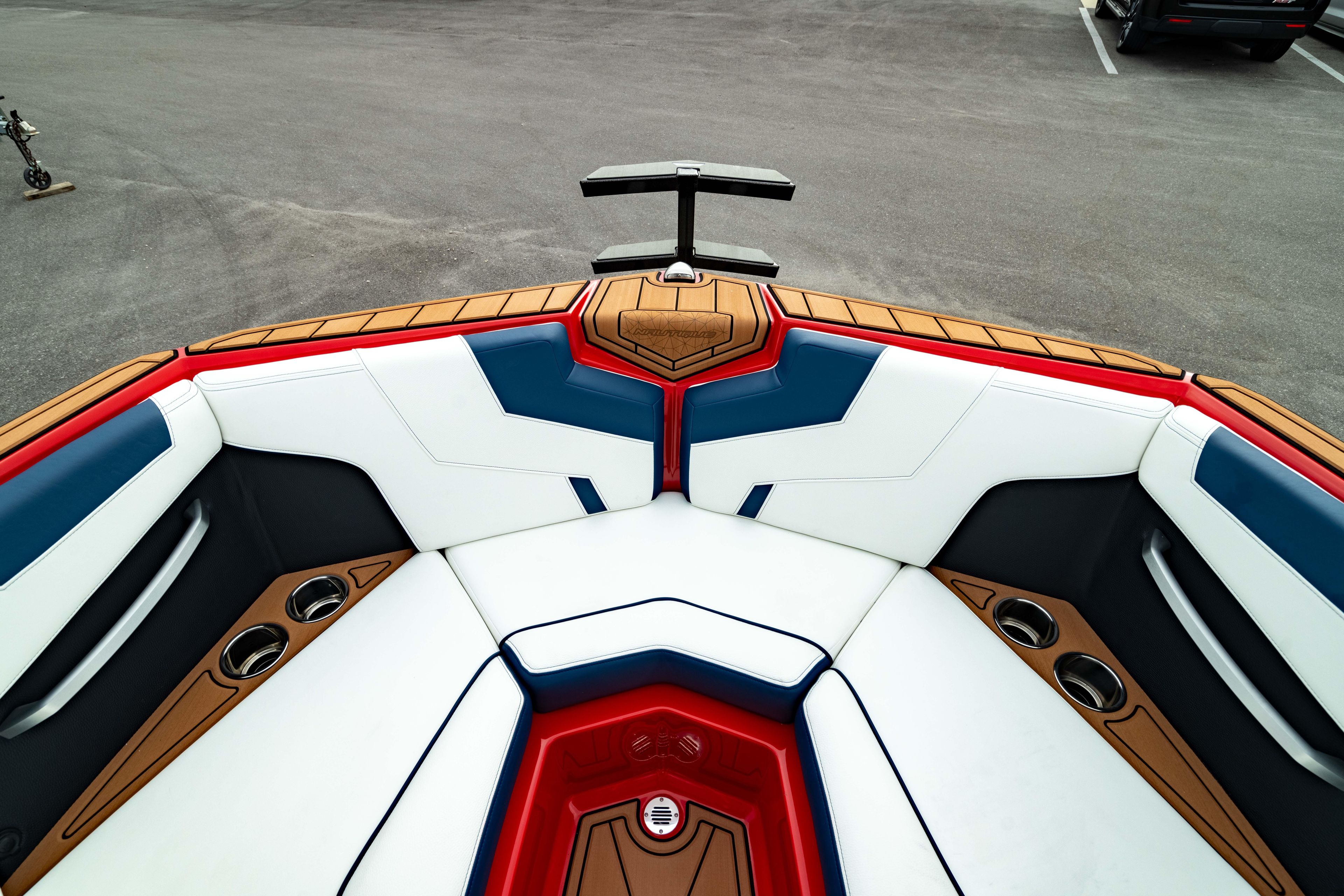 2025 Nautique Super Air Nautique GS20 boat interior with stylish seating and cup holders.