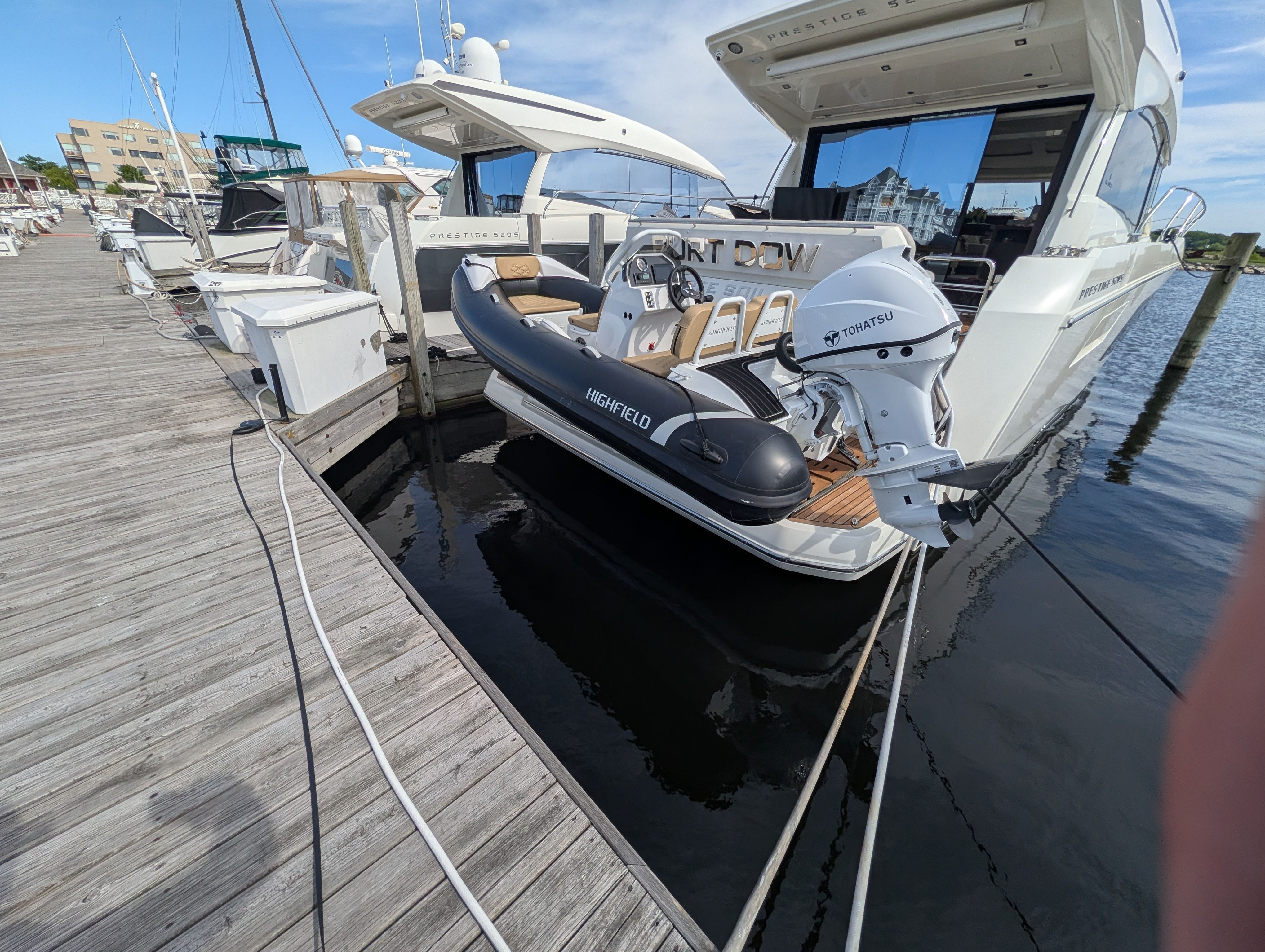 2024 Highfield Sport 390 inflatable boat docked at marina.