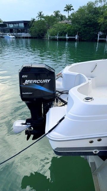 A 2004 Wellcraft 180 Fisherman with a Mercury outboard motor on calm water.