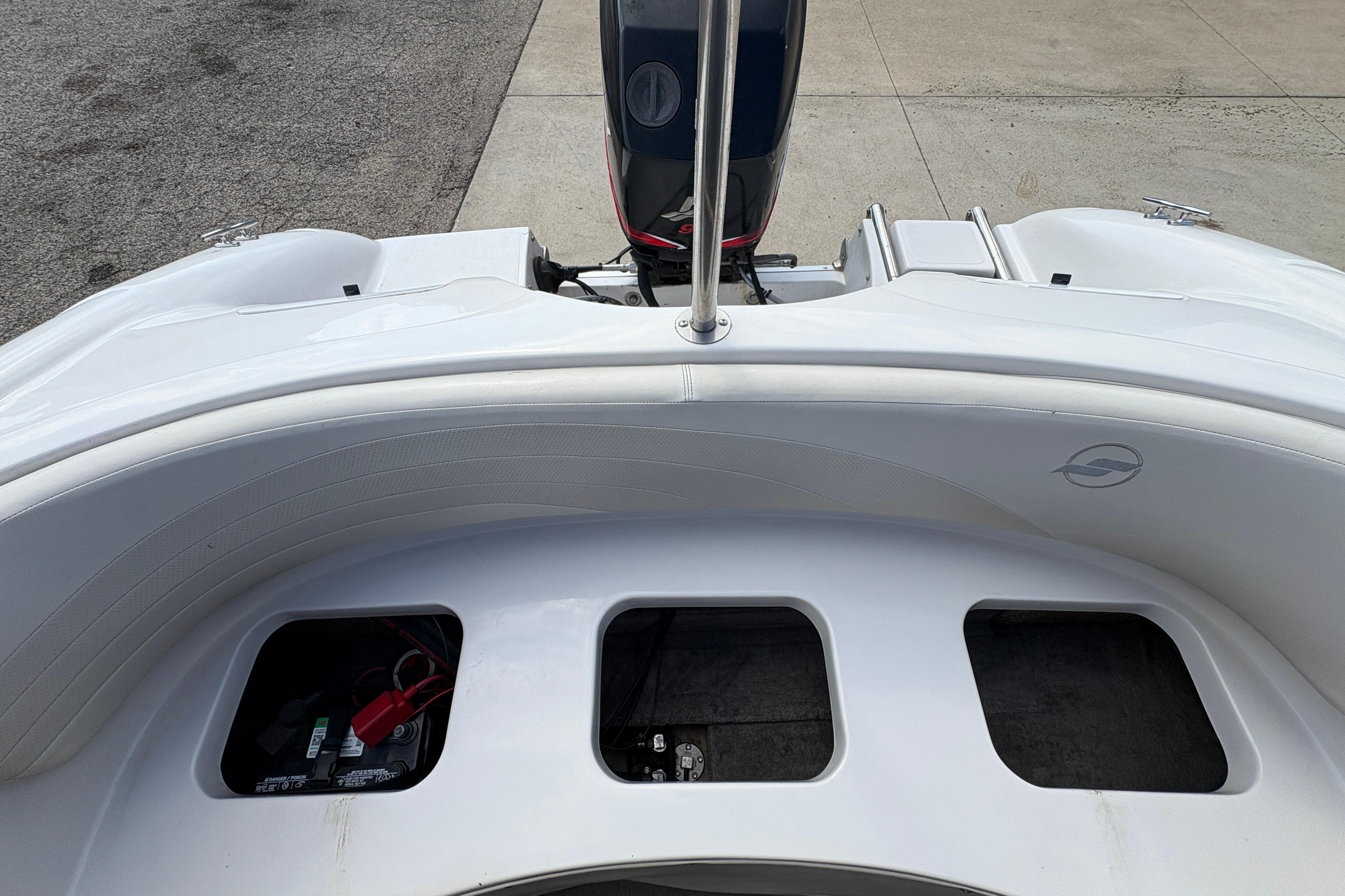 2005 Starcraft C-Star 1700 OB boat interior with motor and storage compartments.