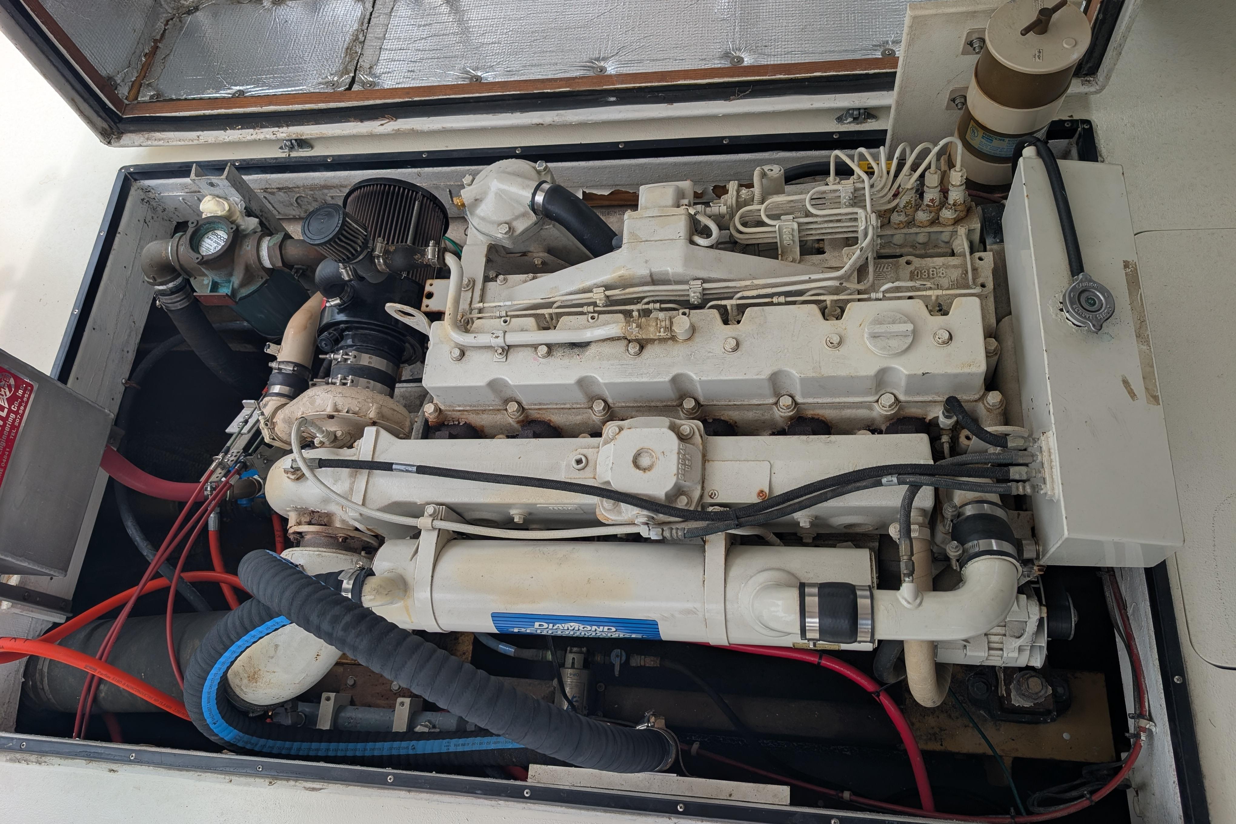 Engine compartment of a 1998 Markley 46 boat, showcasing detailed mechanical components.