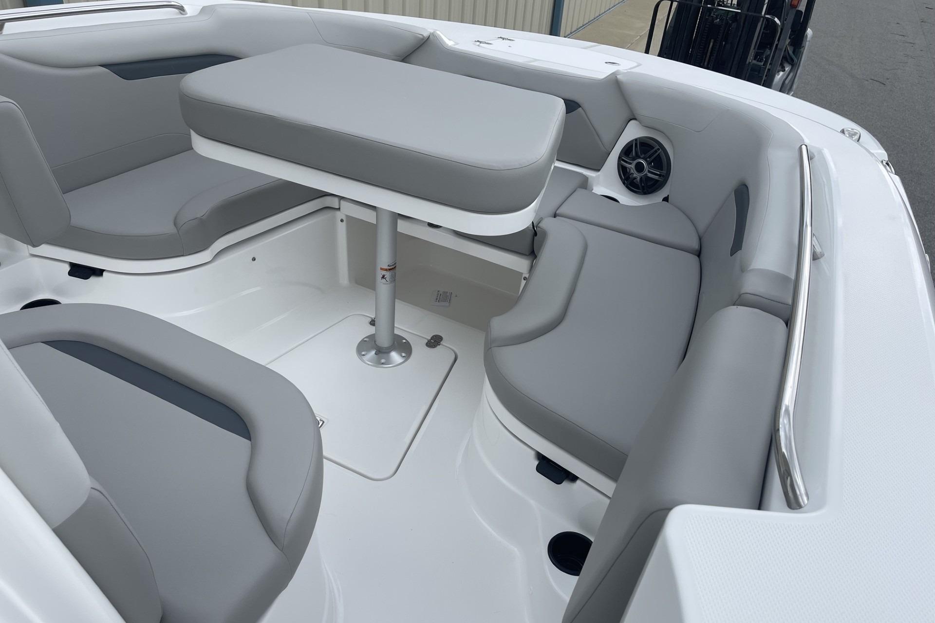 2026 Hurricane Center Console 24 OB boat interior with gray seating and table.