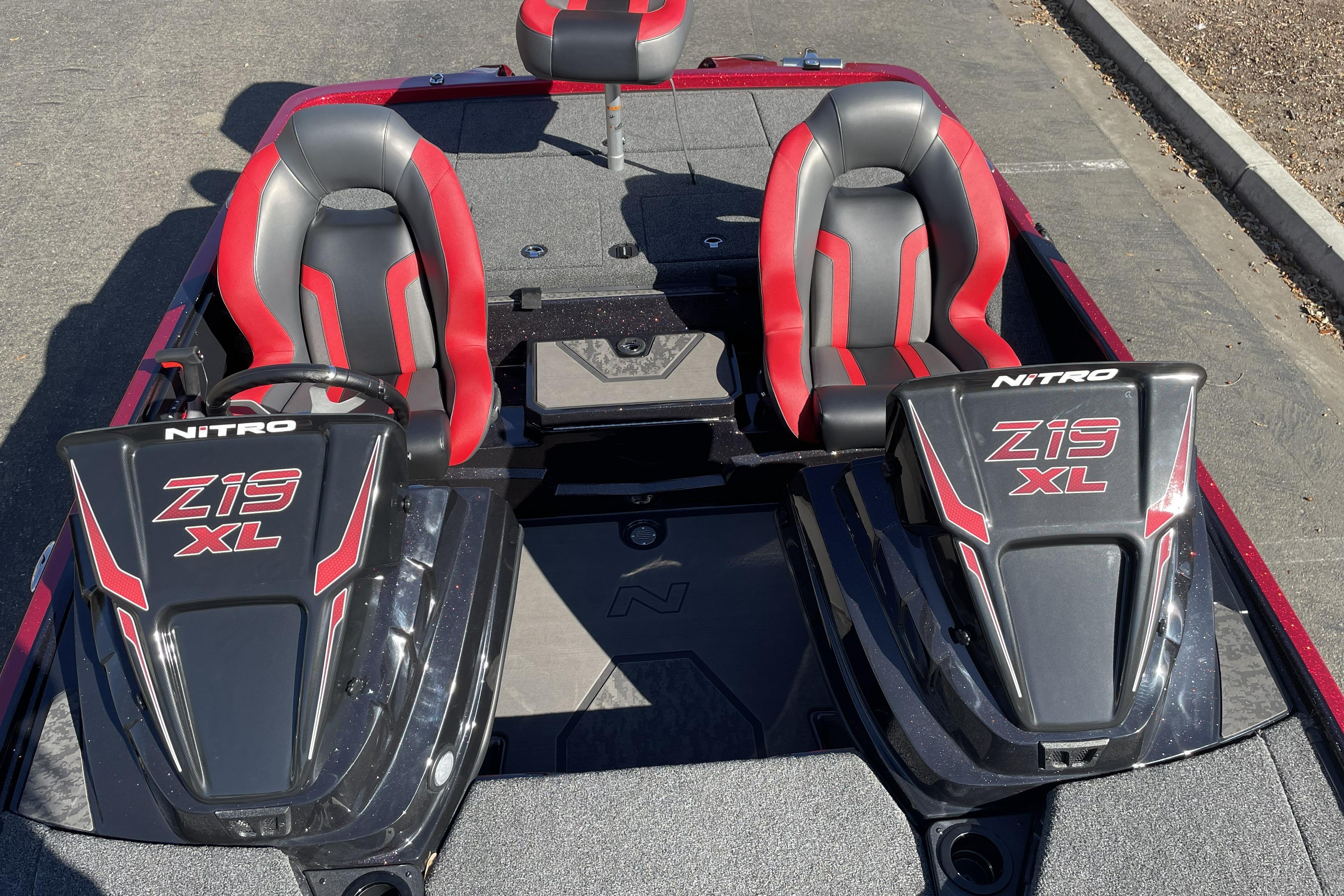 2026 Nitro Z19 XL boat interior with red and black seats, dual consoles.