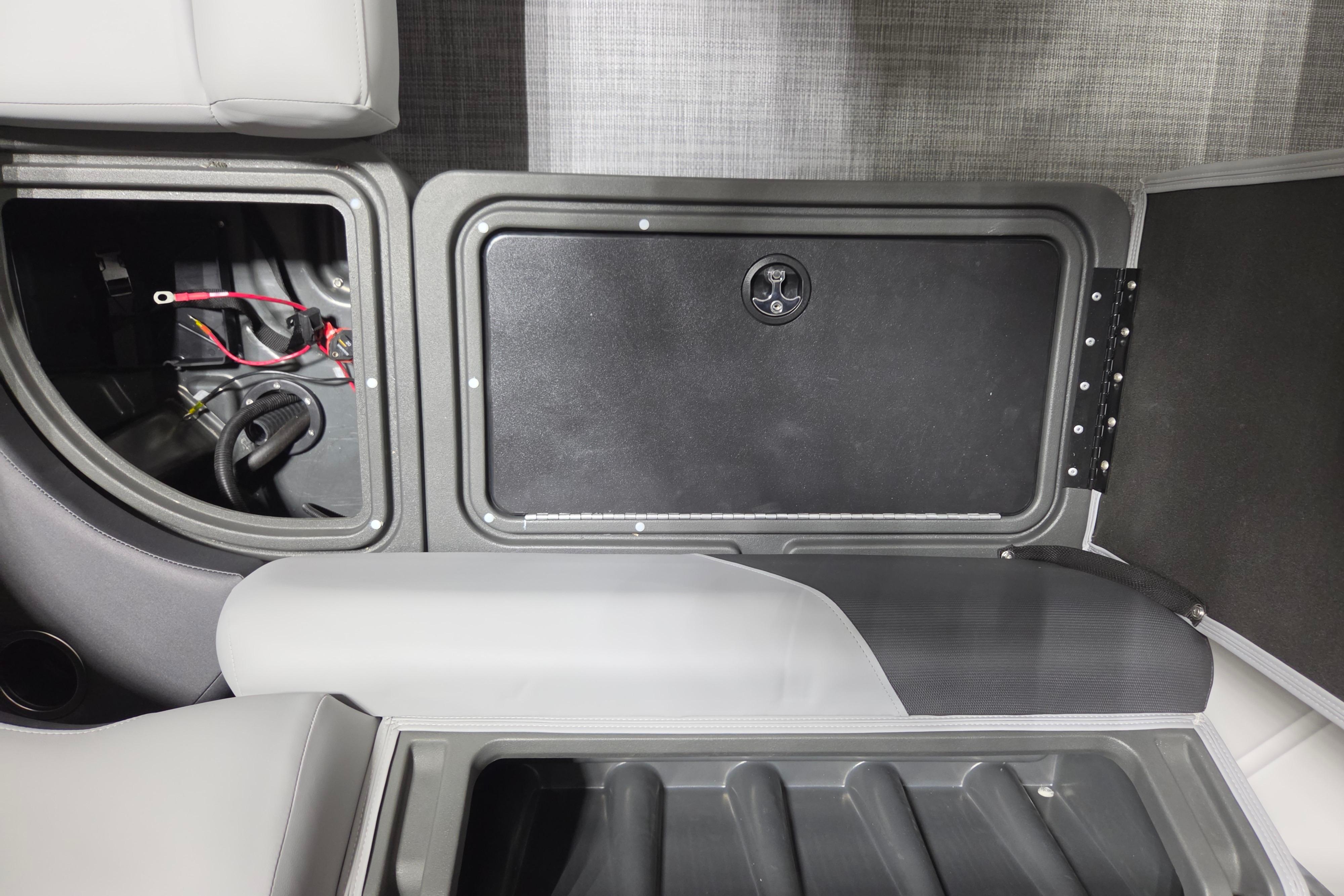2026 Sun Tracker Party Barge 20 DLX interior storage compartment with wiring visible.