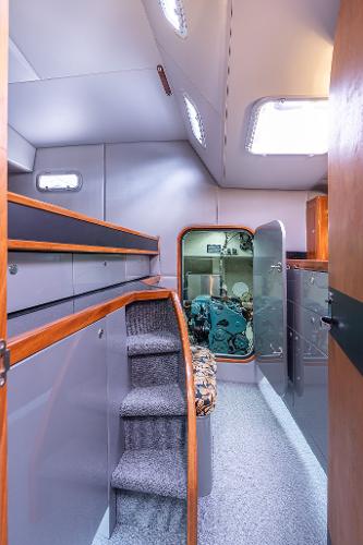 Interior of 2025 Shuttleworth 52 AeroRig yacht, featuring modern design and compact staircase.