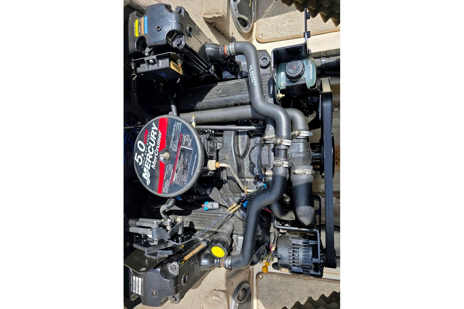 Engine of a 2007 Sea Ray 205 Sport boat, featuring a 5.0 Mercury motor.