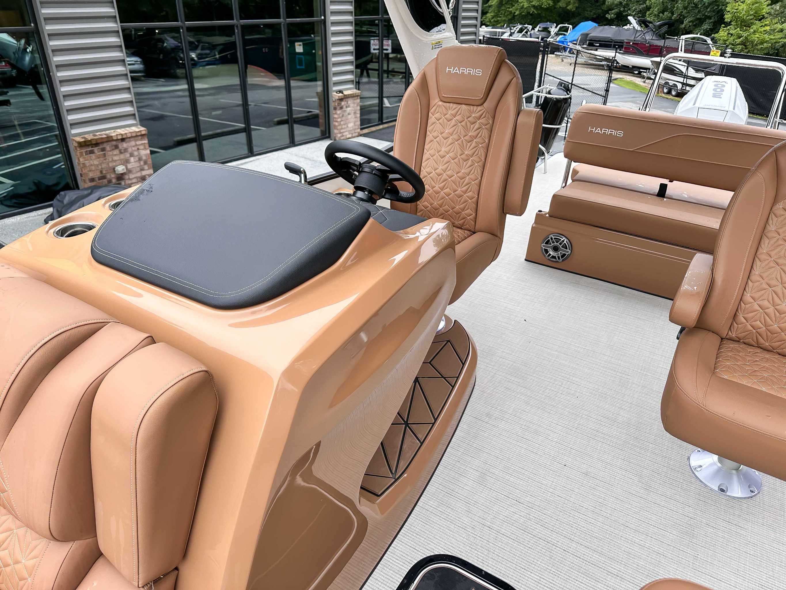 Interior of 2025 Harris Grand Mariner 230 SLDH with luxurious seating.
