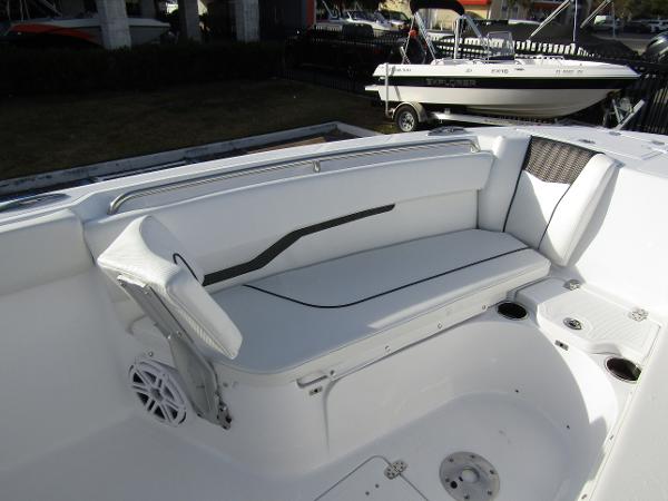 2025 Wellcraft 243 Fisherman boat interior with white seating and cup holders.