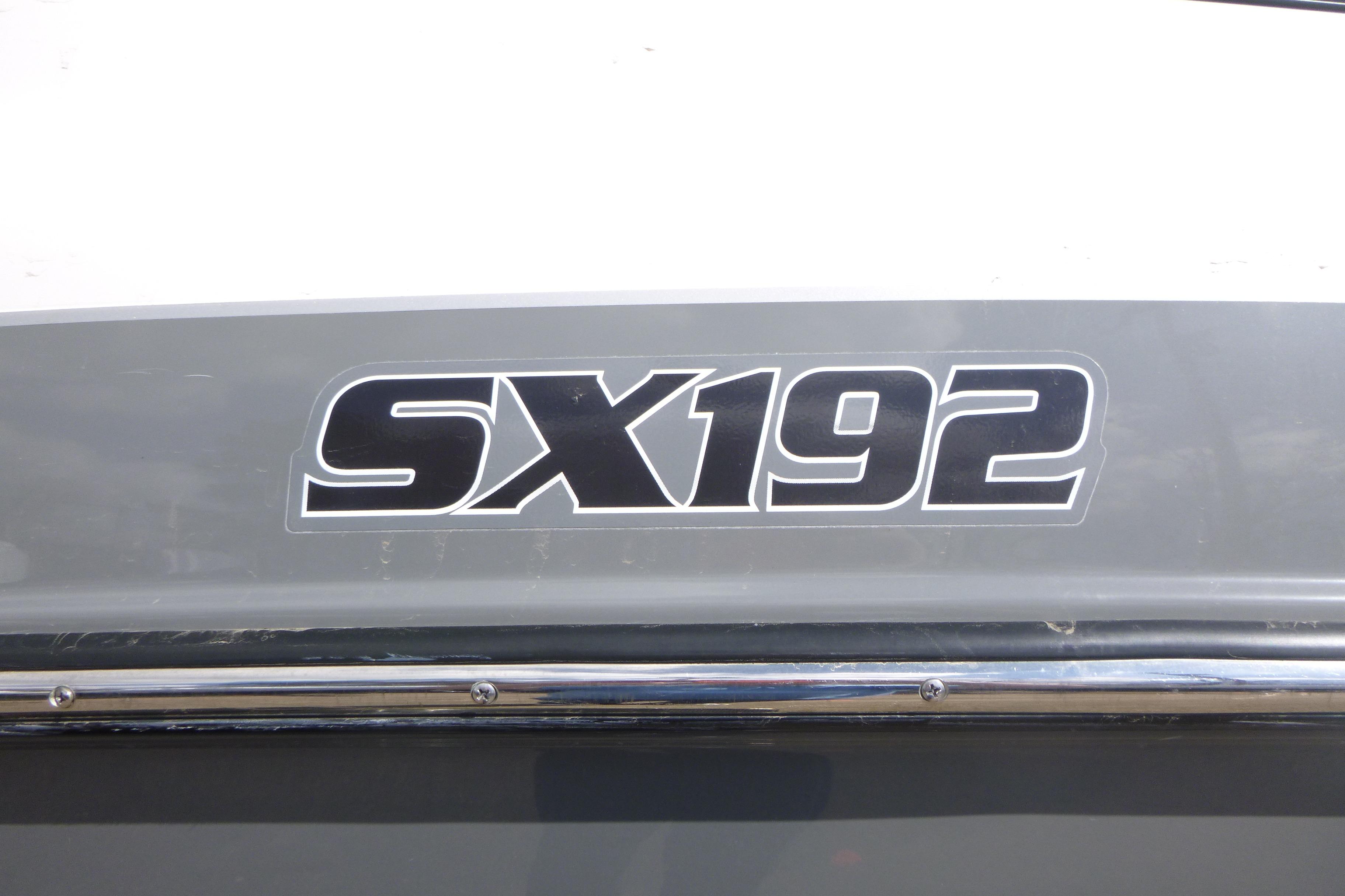 2015 Yamaha Boats SX192 logo on a gray and white boat exterior.