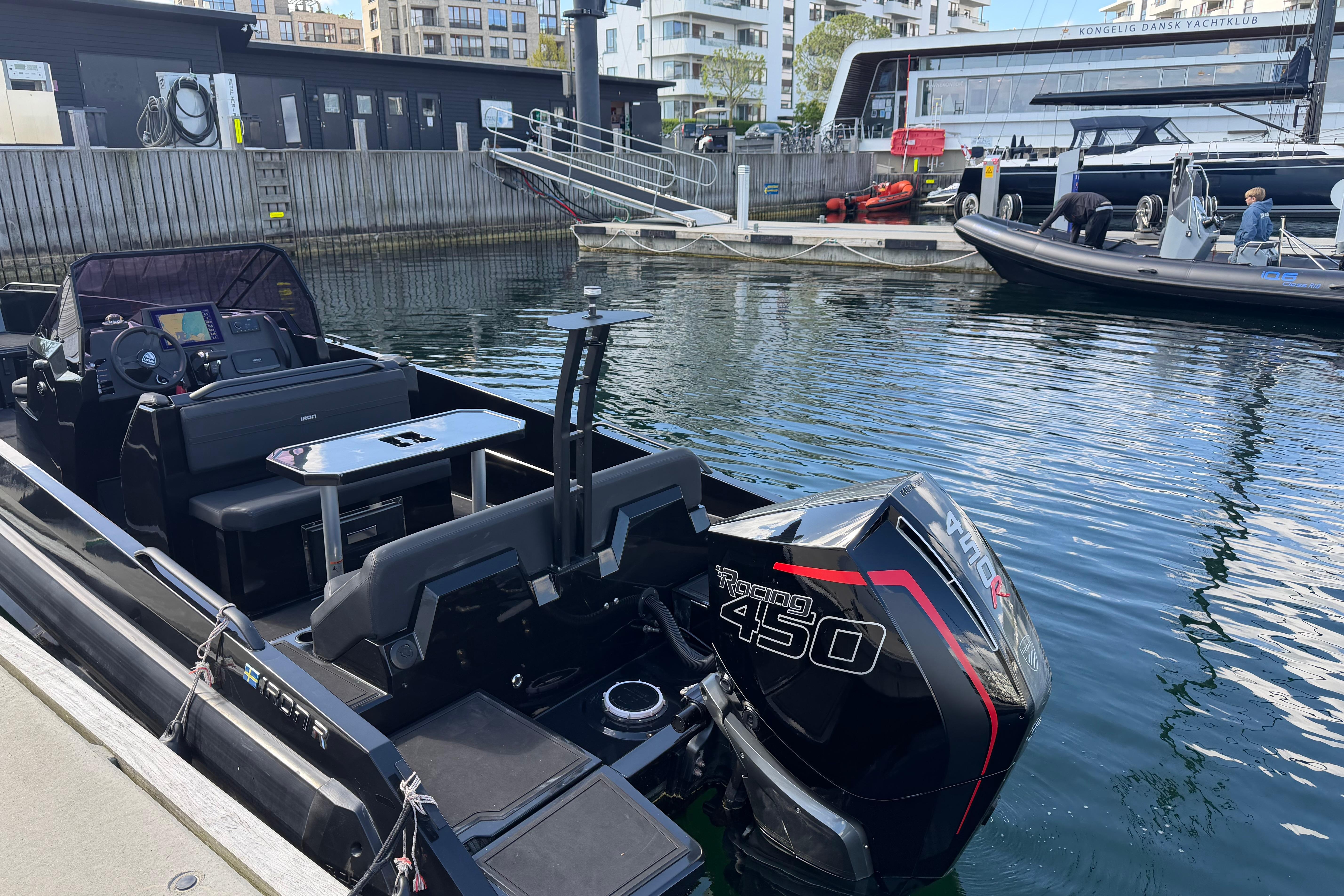 Iron 827R boat with Racing 450 engine docked at a marina, 2022 model.