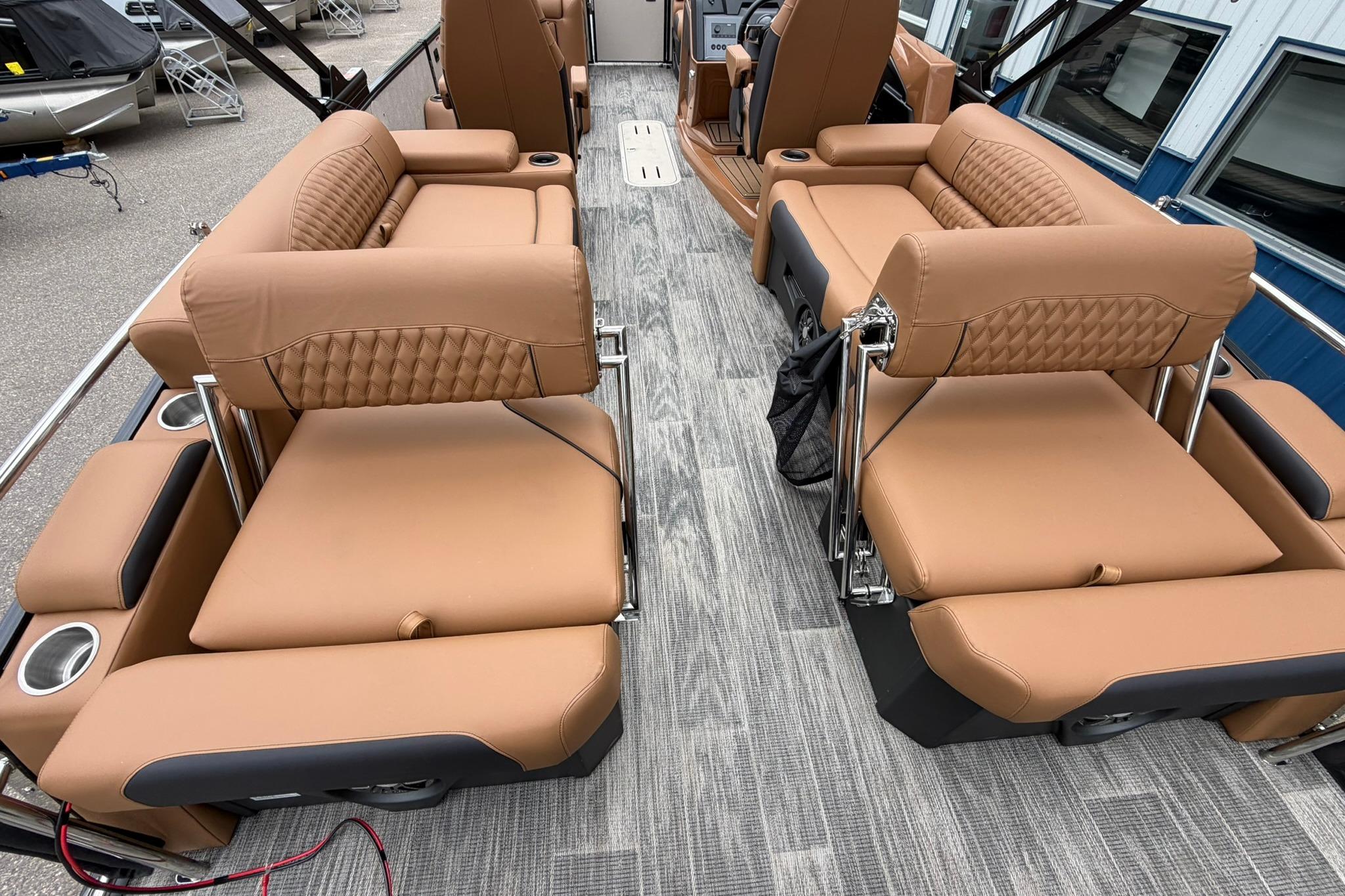 Luxurious interior of 2026 Avalon Catalina Quad Lounge Shift boat with tan seating.