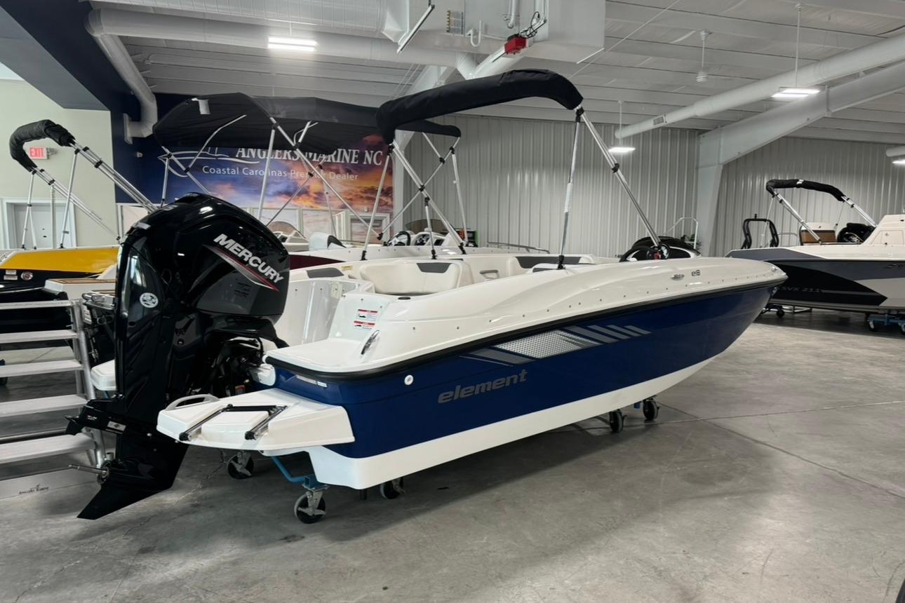 2025 Bayliner Element E18 boat with Mercury engine in showroom.