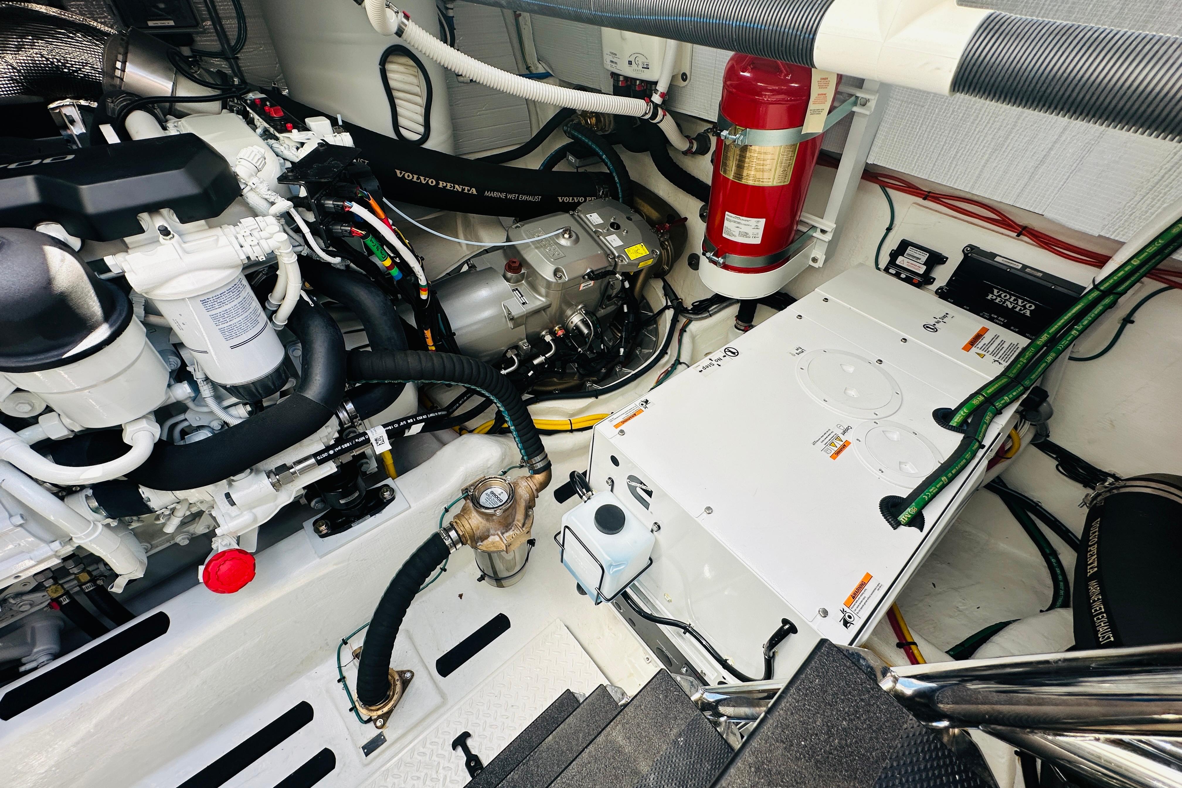Engine room of 2025 Sabre 48 Salon Express with Volvo Penta components and safety equipment.