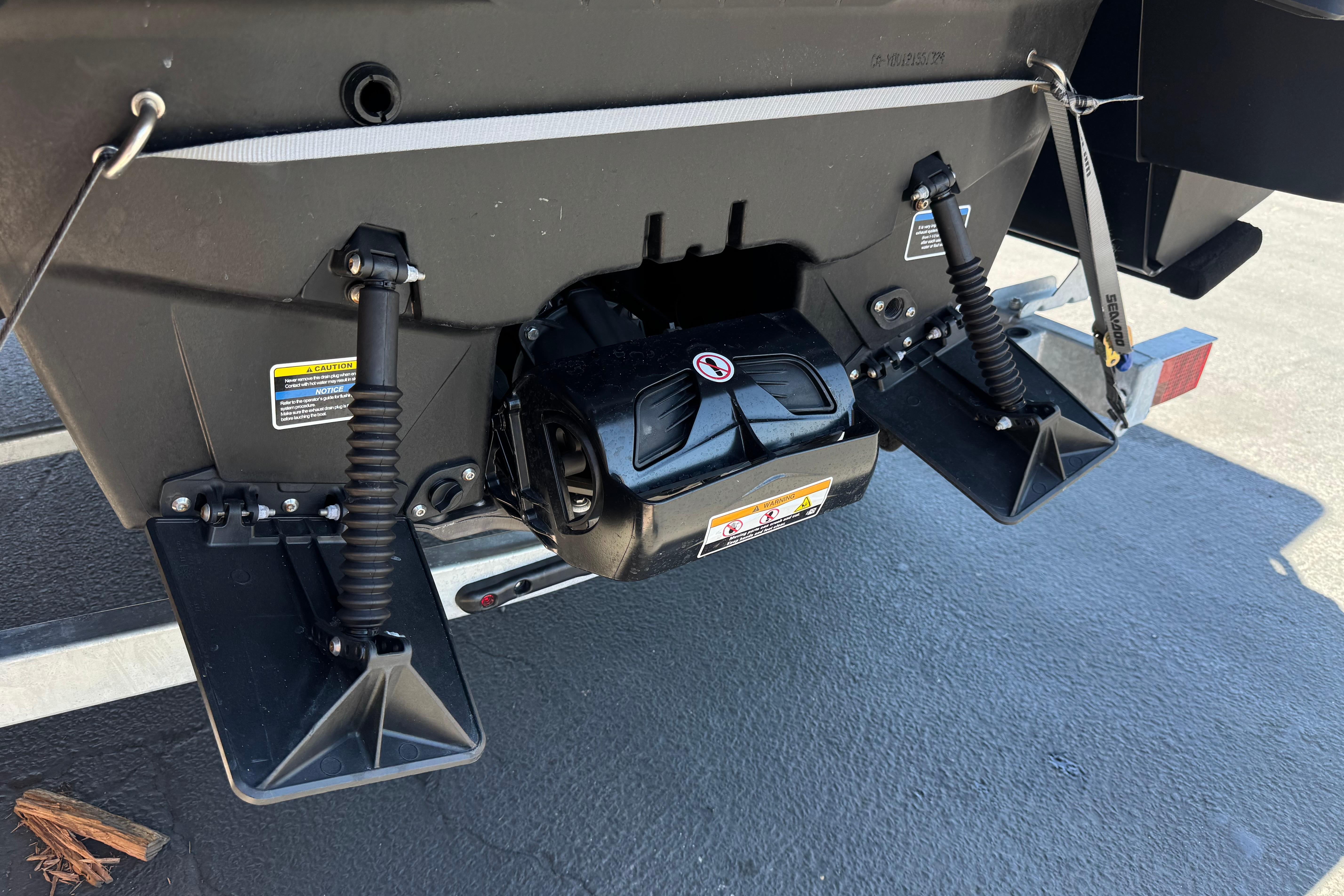 2024 Sea-Doo Switch Compact rear view showcasing propulsion system and trim tabs.
