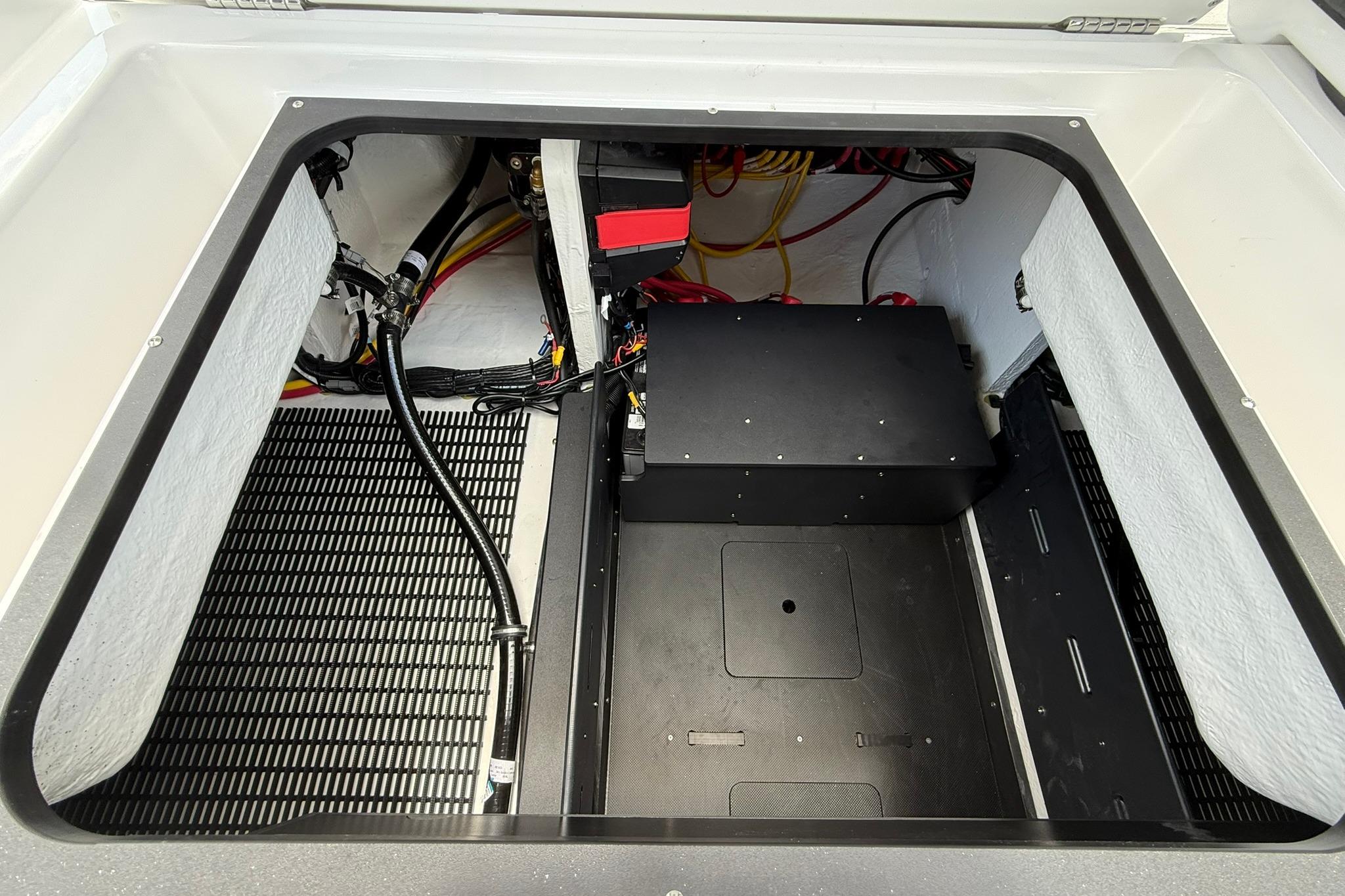 Engine compartment of 2027 Monterey Elite 30 OB boat, showcasing wiring and components.