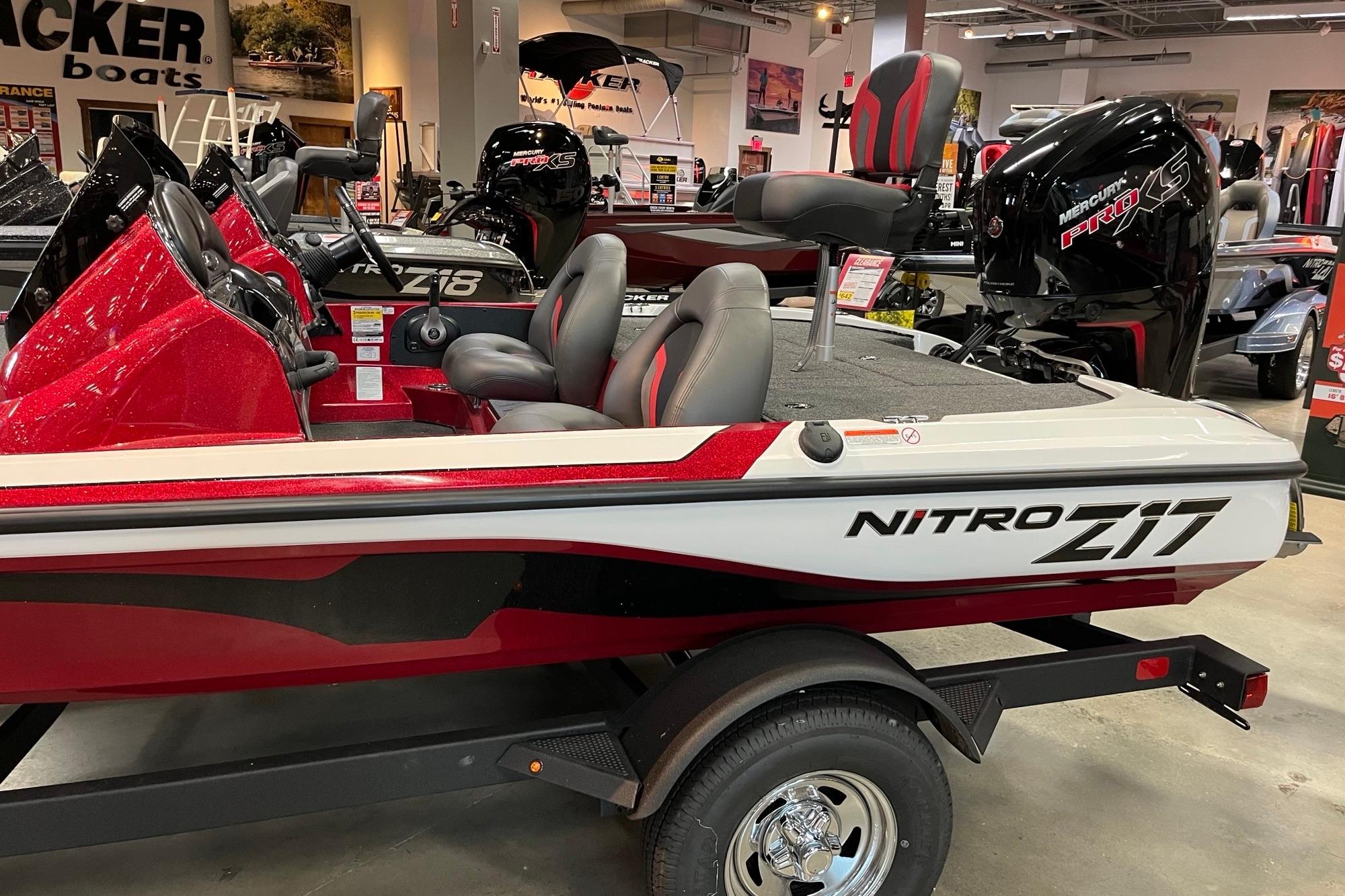 2026 Nitro Z17 boat in showroom, featuring sleek red and white design.