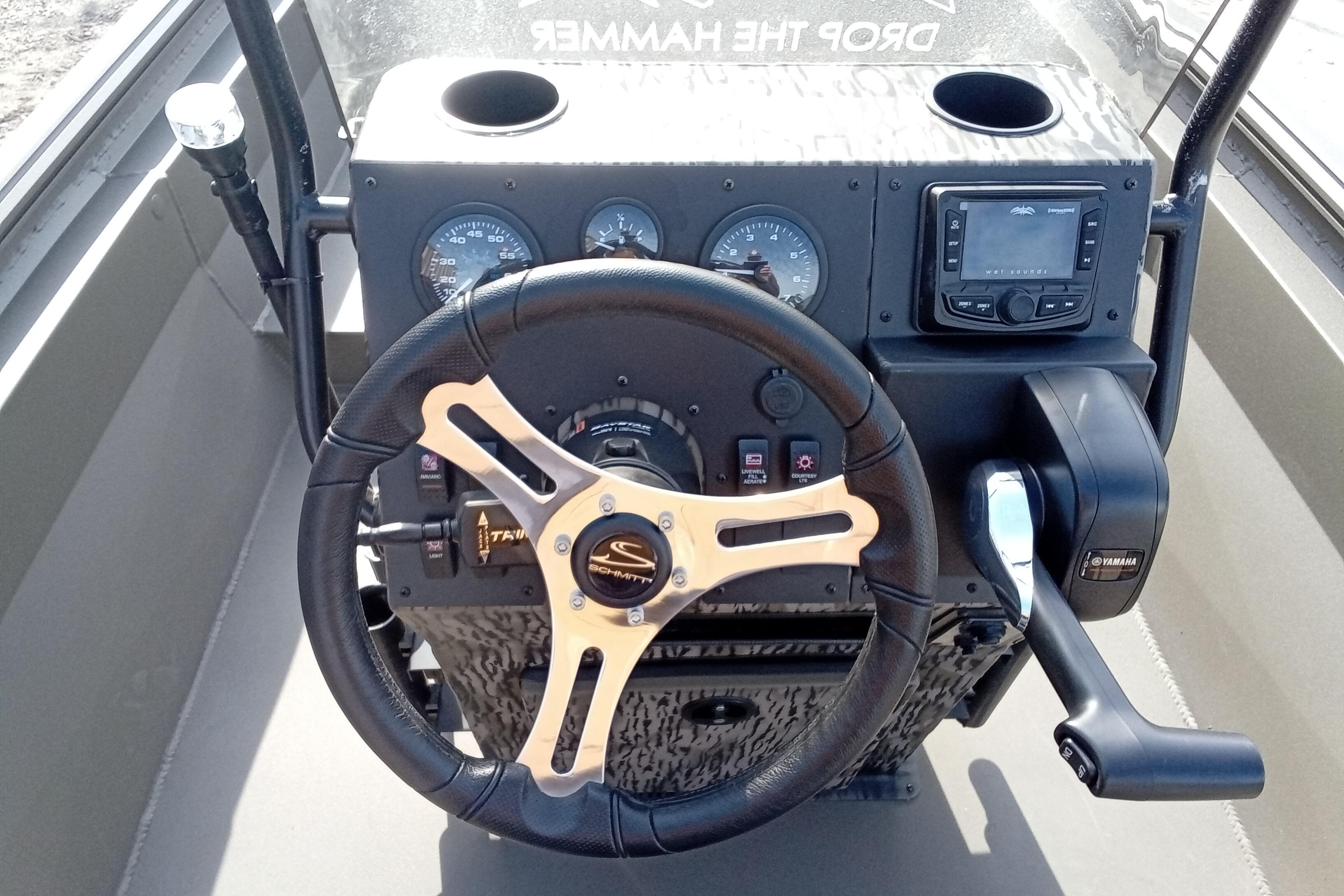 Steering console of 2026 Thor 1900 Low Country Elite boat with gauges and controls.