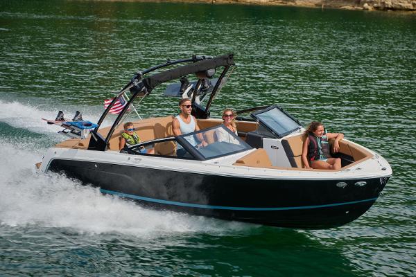 Manufacturer Provided Image: 2025 Cobalt CS23 boat cruising on a lake with passengers enjoying the ride.