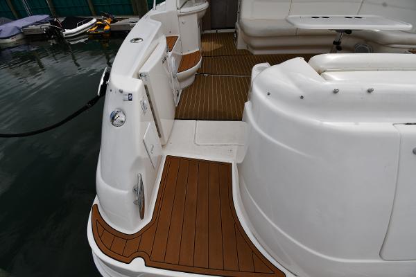 2003 Sea Ray 460 Sundancer yacht deck with teak flooring and seating area.