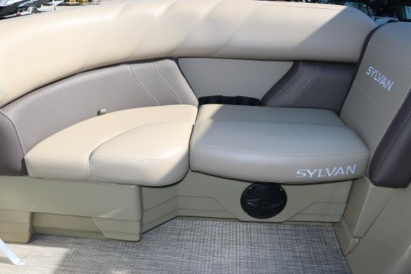 2025 Sylvan Mirage 820 CLZ DH boat interior seating with beige upholstery.