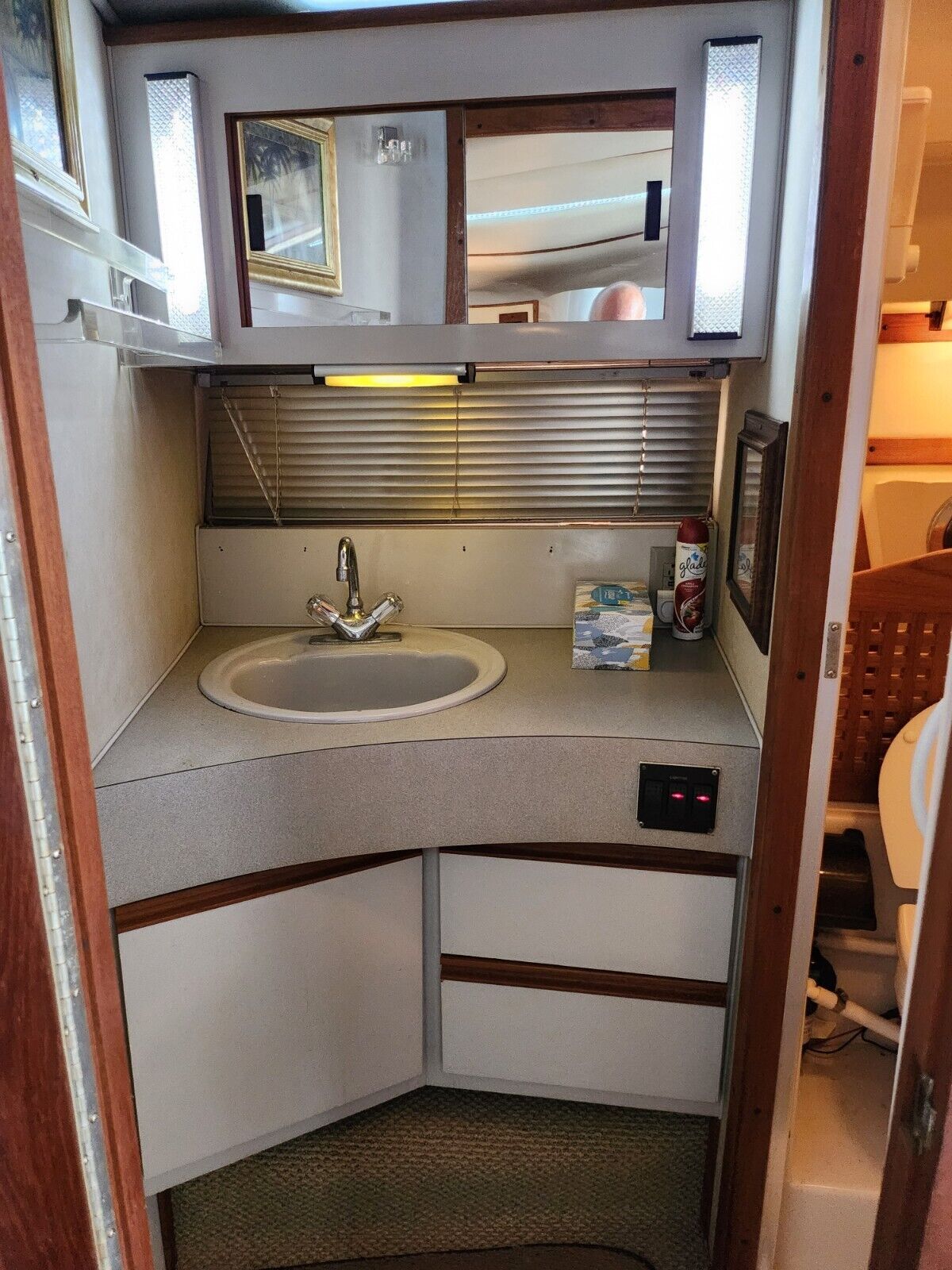 Interior of 1988 Regal Commodore 360 with sink and mirror.