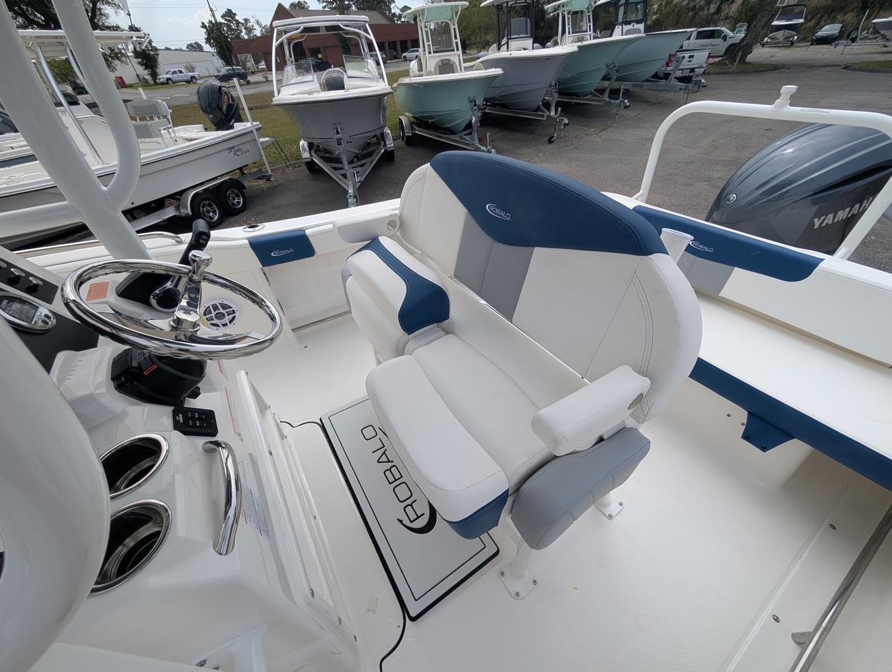 2025 Robalo R222 Explorer boat interior with steering wheel and seating.