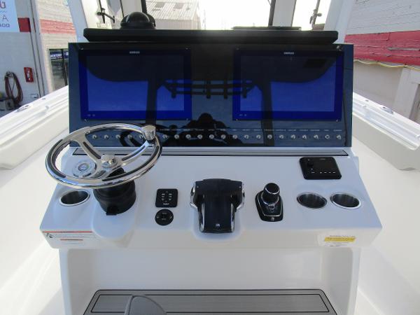 2024 Sea Pro 322 Offshore boat helm with dual screens and modern controls.