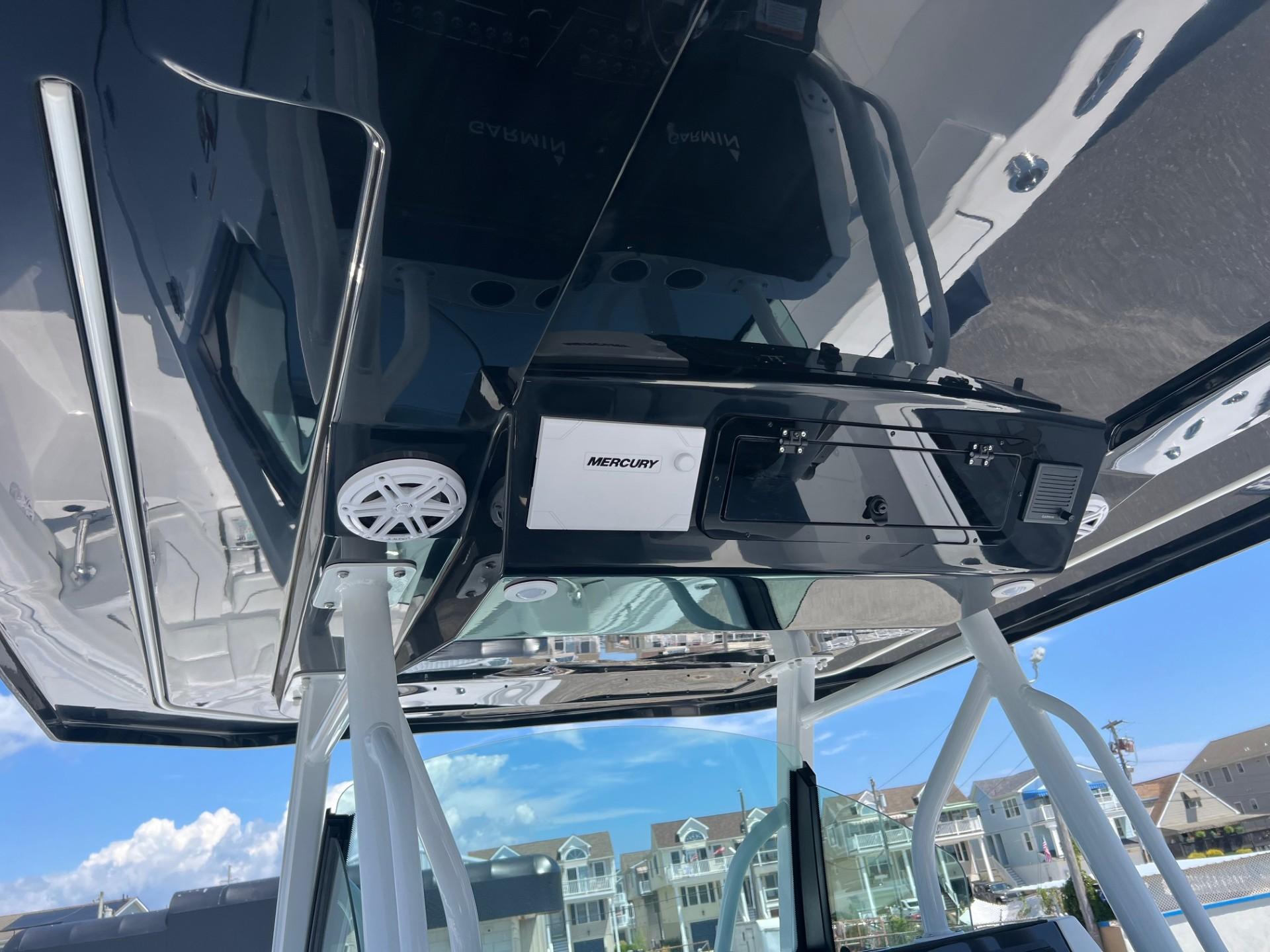 2025 Wellcraft 352 Fisherman boat console with Mercury electronics and speakers.