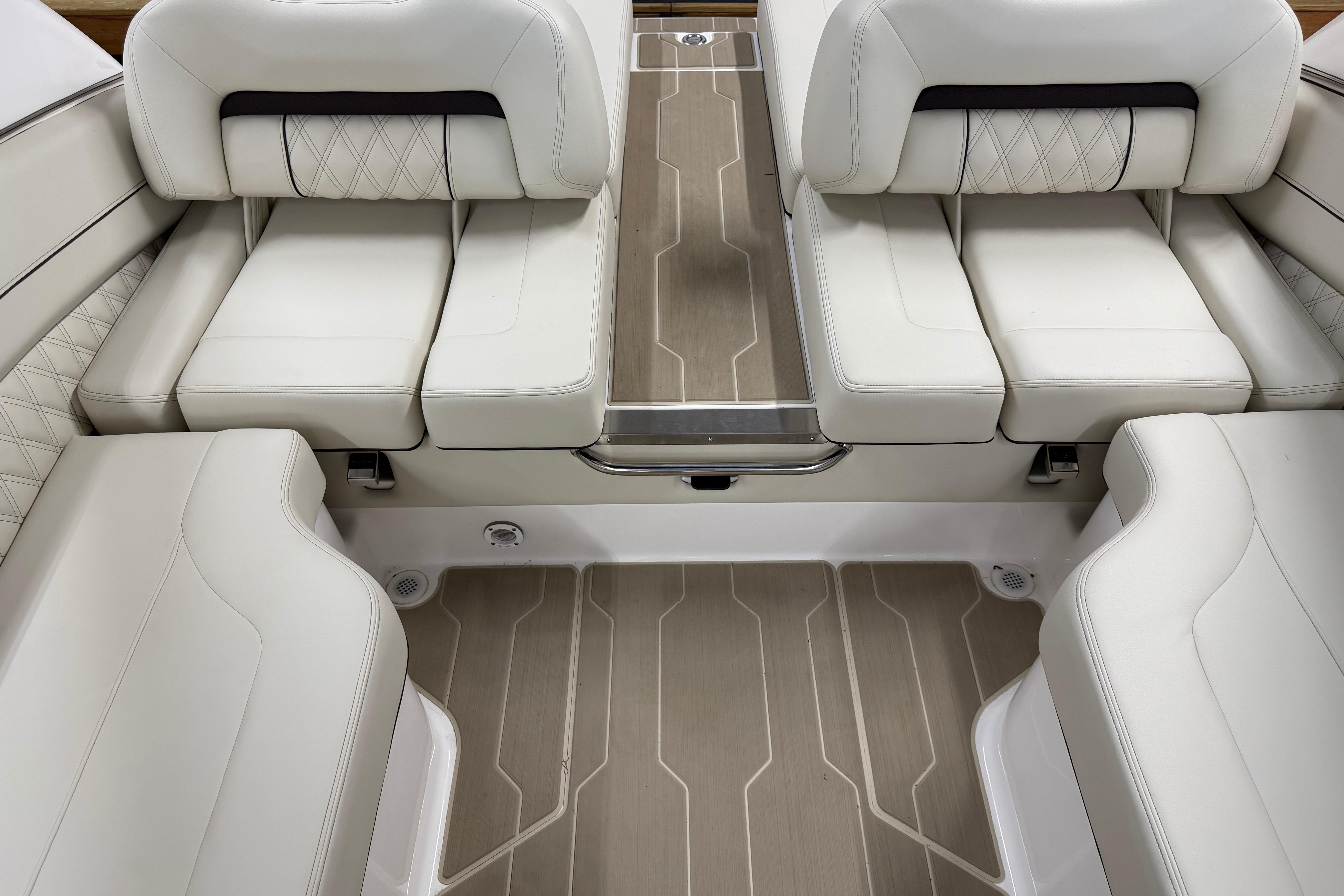 Luxurious interior seating of 2026 Regal LS6 boat with elegant white upholstery.