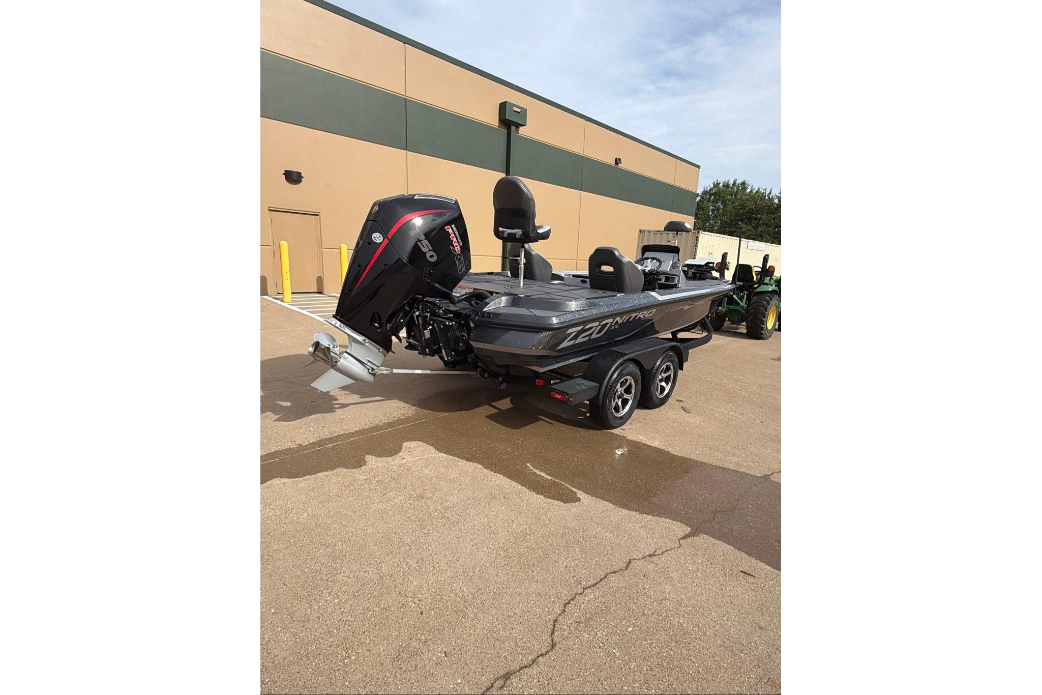 2026 Nitro Z20 XL boat with powerful outboard motor, parked outdoors.