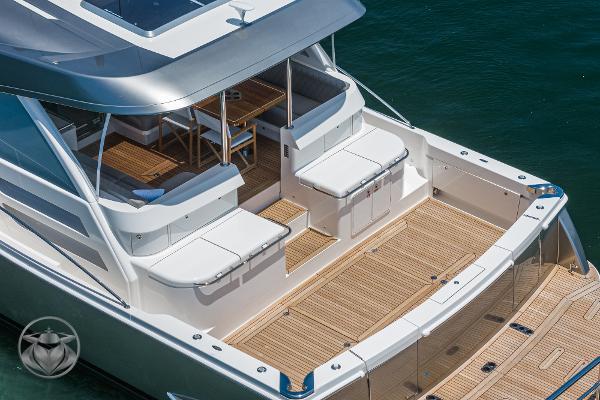 2025 Riviera 645 SUV luxury yacht with spacious deck and seating area.