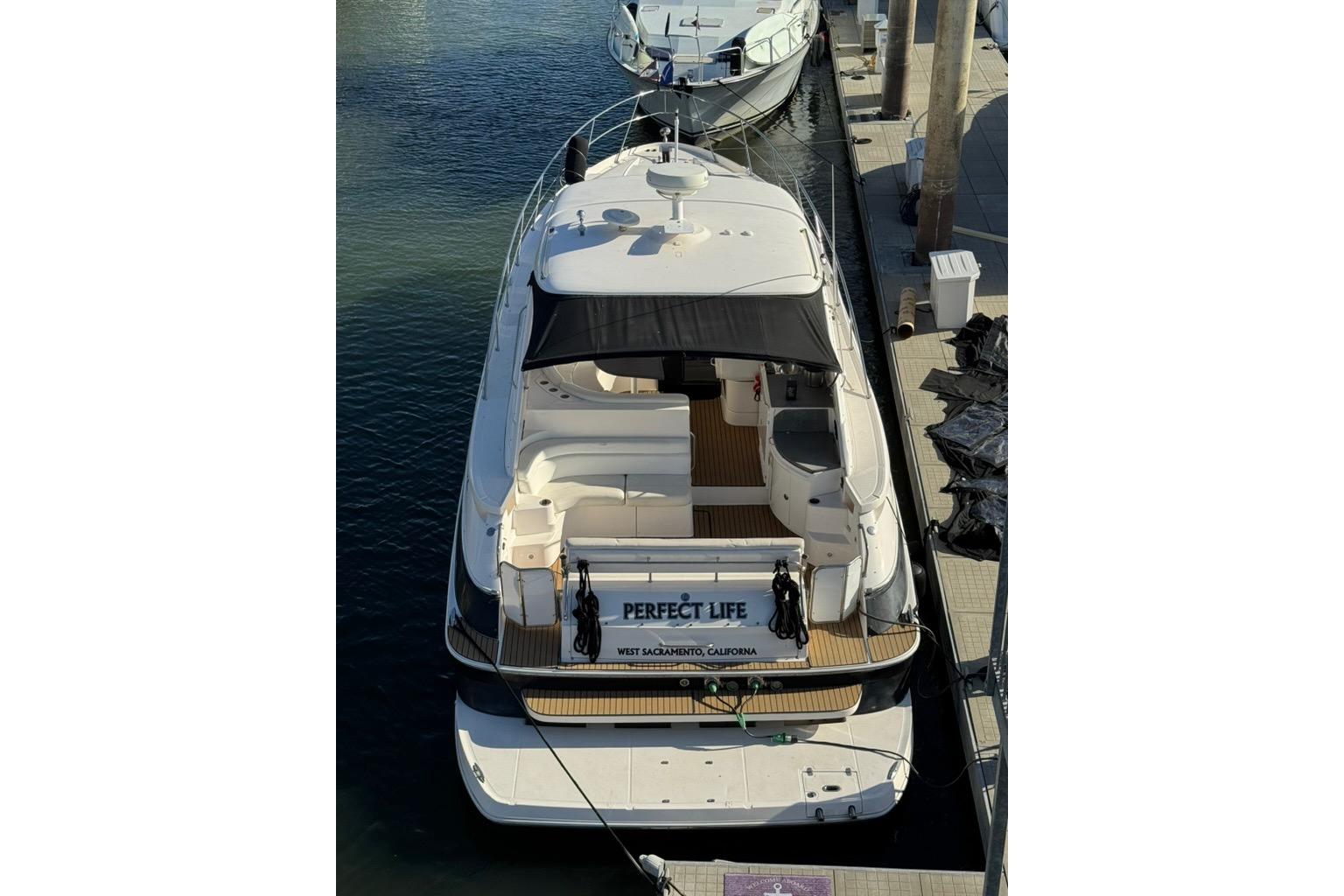 2006 Regal Commodore 4460 yacht docked at marina, aerial view.