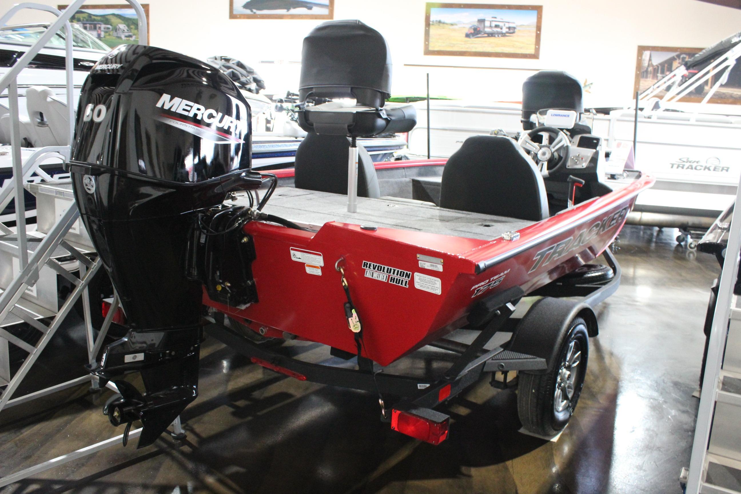 2026 Tracker Pro Team 175 boat with Mercury engine, displayed indoors.