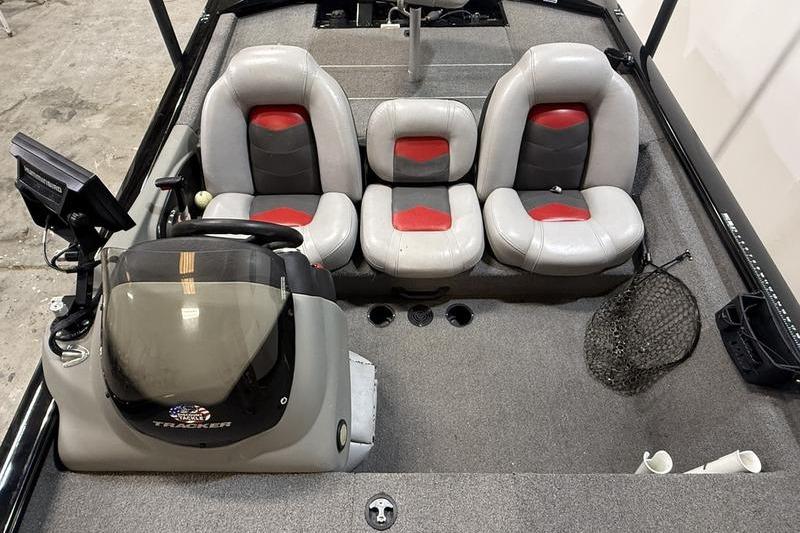 2016 Tracker Pro Team 175 TXW boat interior with three seats and steering console.