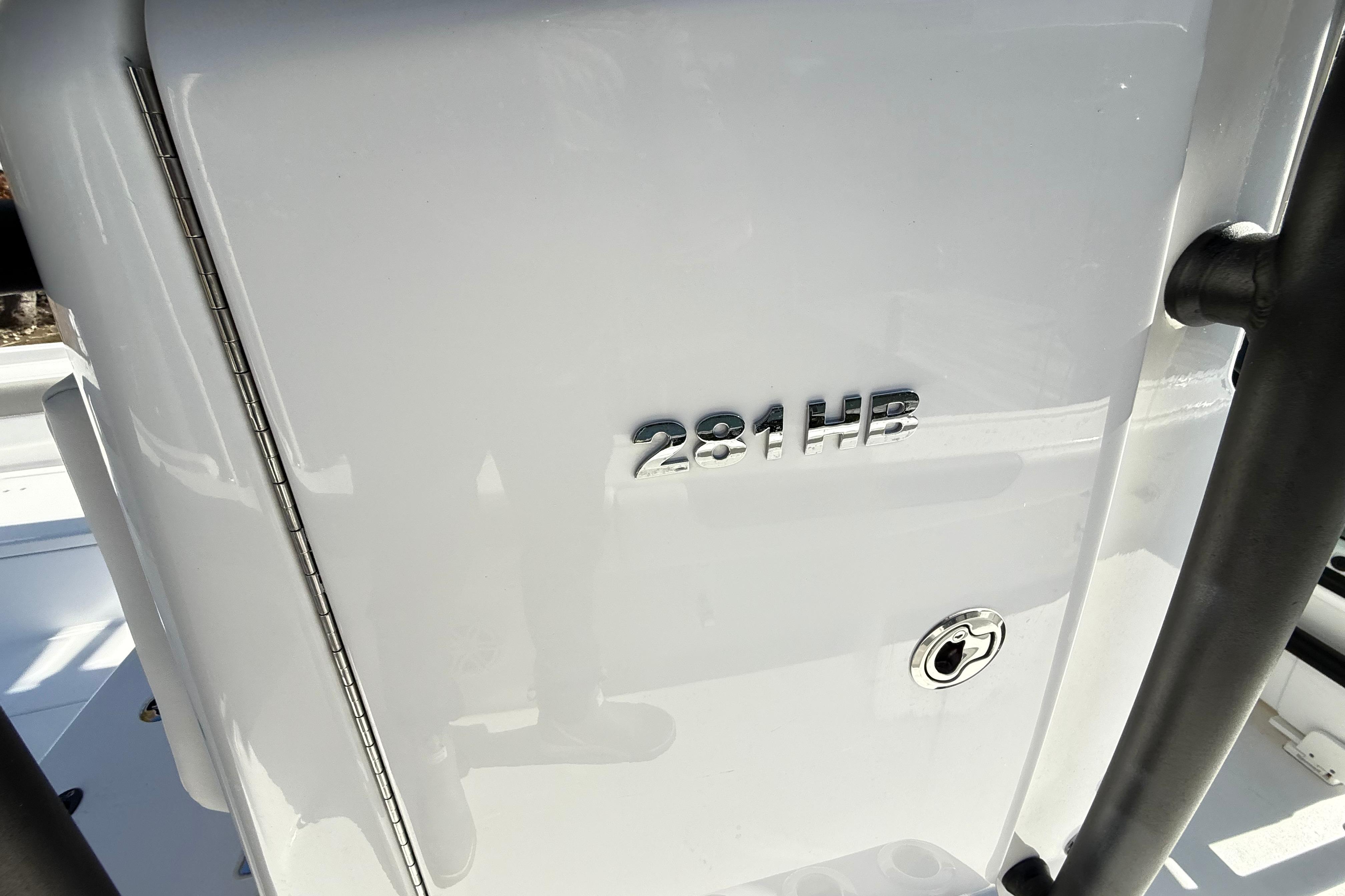 2023 Caymas 281 HB boat detail with model emblem and sleek design.