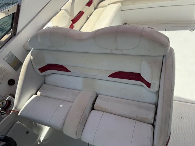 The interior of a 2005 Formula 280 Bowrider with white and red seating.