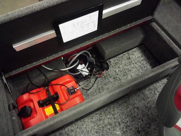 Storage compartment in 2025 Ranger VS1665 SC boat with red fuel tank and wiring.