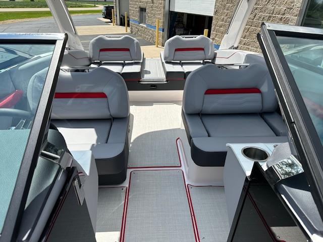2025 Regal LS4 boat interior with gray seating and red accents.